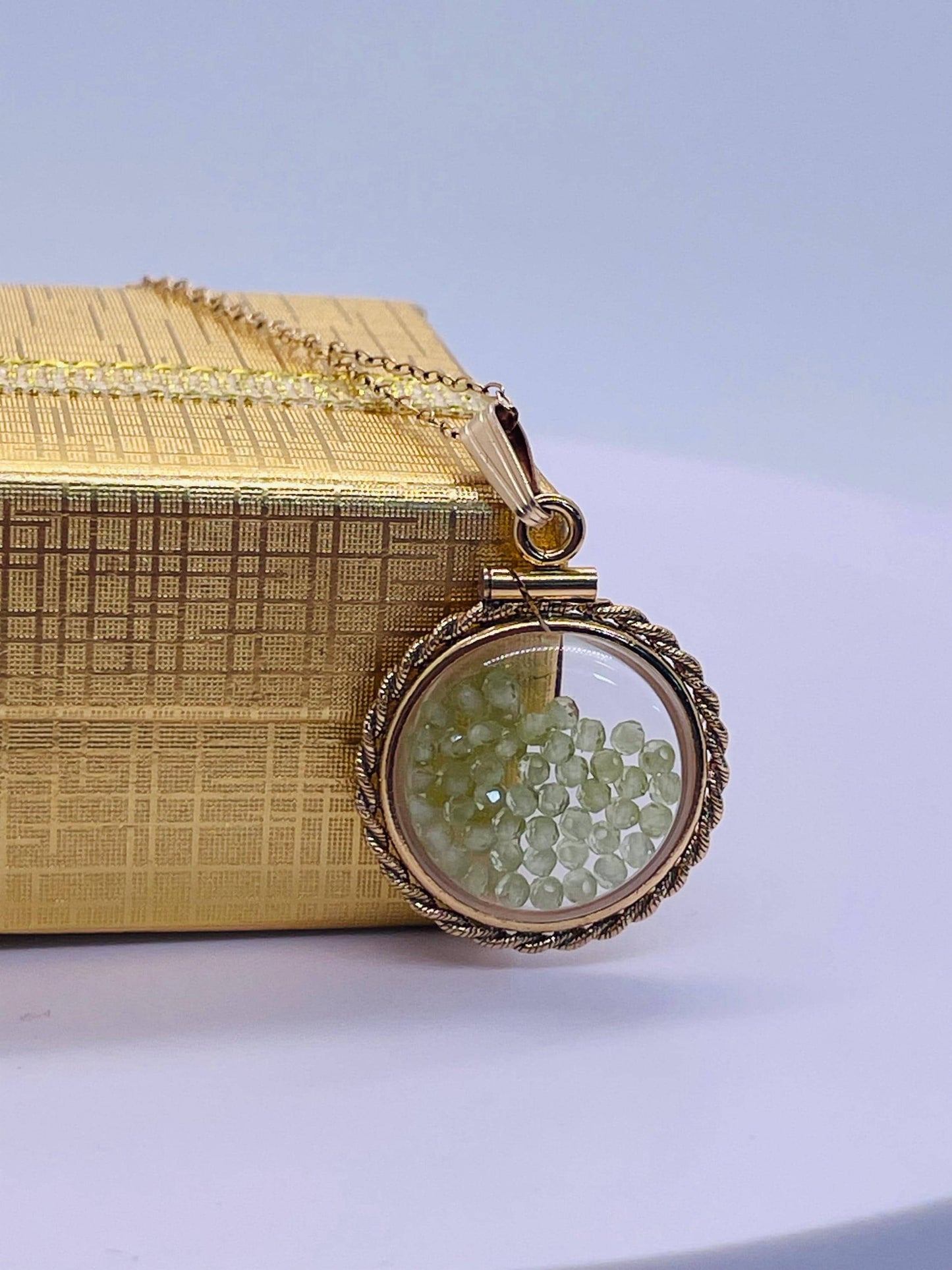 Hand made 21 mm nickel size 14k gold filled lucite genuine peridot shaker locket with rope edge and  beautiful bead crystals.