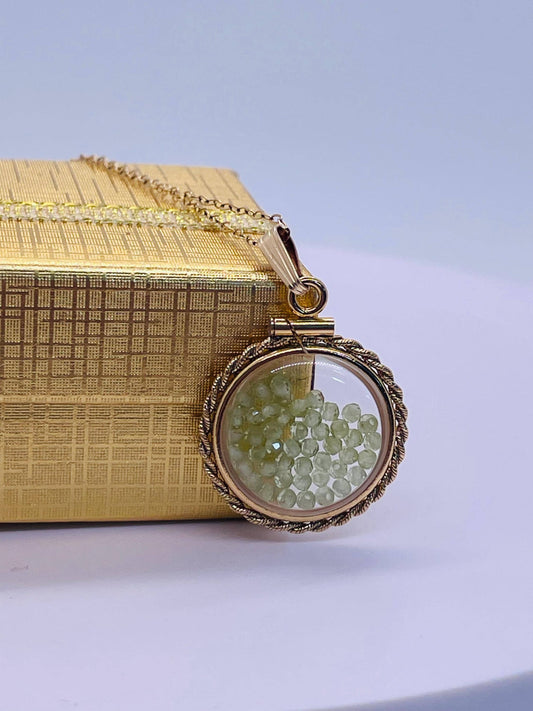 Hand made 21 mm nickel size 14k gold filled lucite genuine peridot shaker locket with rope edge and  beautiful bead crystals.