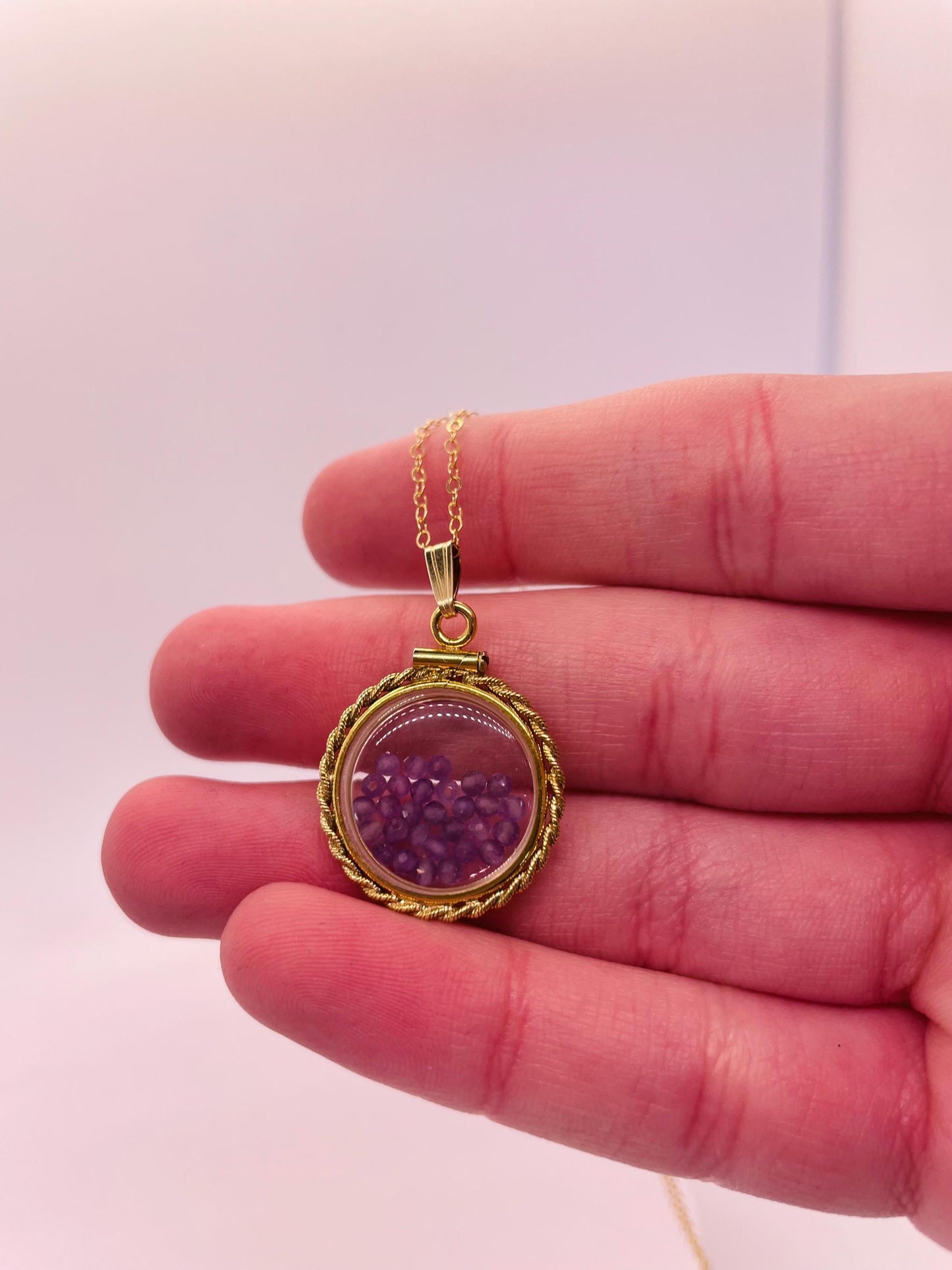 Hand made 21 mm nickel size 14k gold filled lucite genuine amethyst shaker locket with rope edge and beautiful bead crystals.