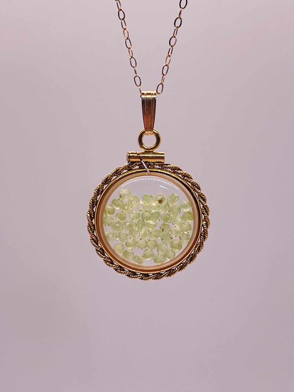 Hand made 21 mm nickel size 14k gold filled lucite genuine peridot shaker locket with rope edge and  beautiful bead crystals.
