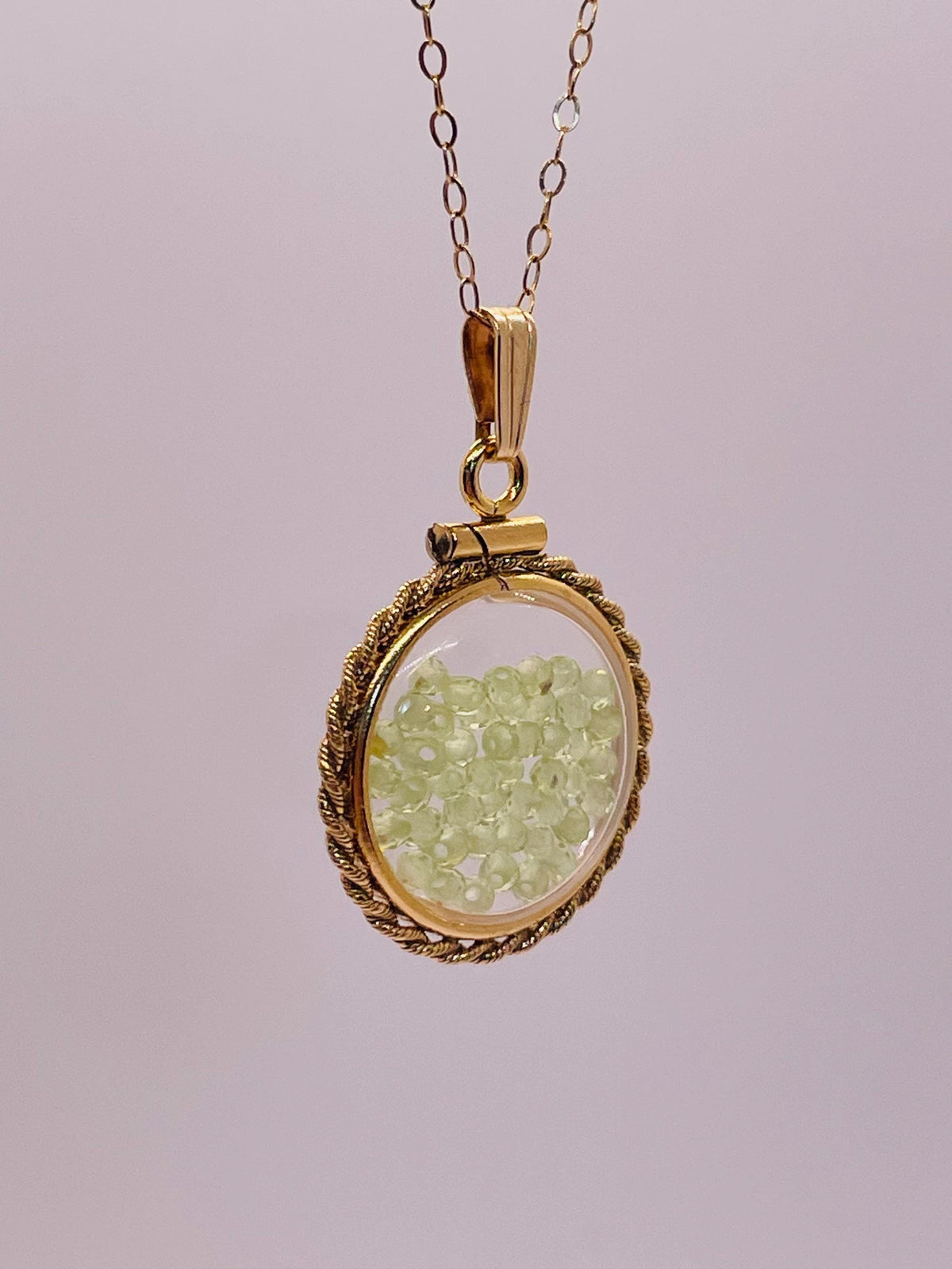Hand made 21 mm nickel size 14k gold filled lucite genuine peridot shaker locket with rope edge and  beautiful bead crystals.