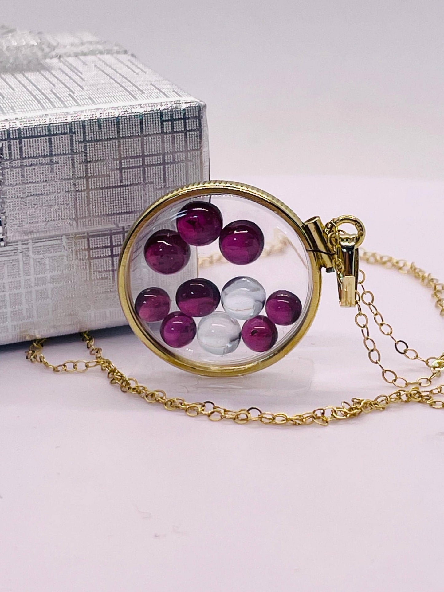 14k solid gold 22 mm handmade shaker locket filled with garnet and white topaz