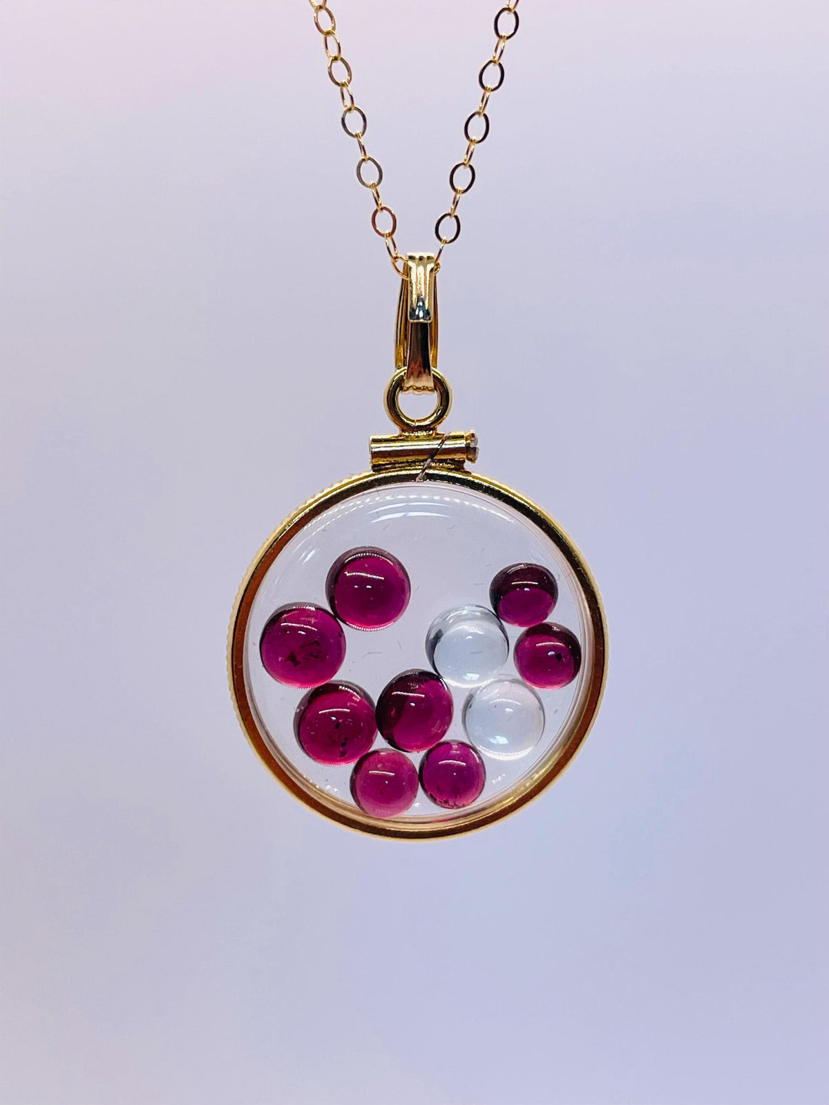 14k solid gold 22 mm handmade shaker locket filled with garnet and white topaz