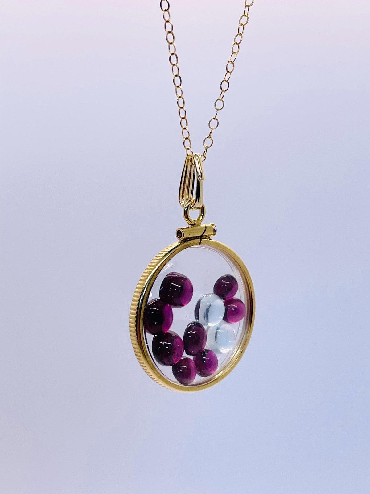 14k solid gold 22 mm handmade shaker locket filled with garnet and white topaz
