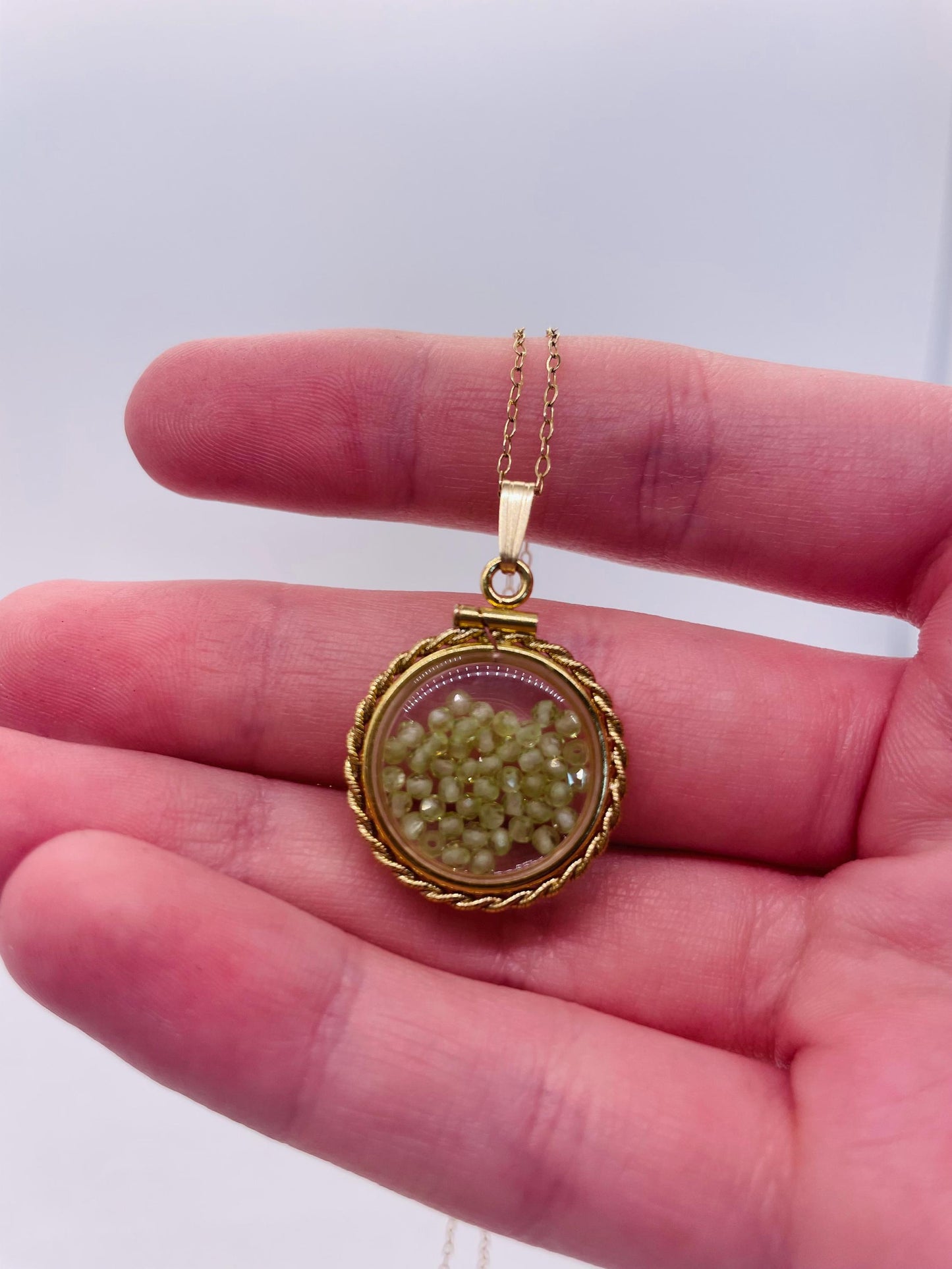 Hand made 21 mm nickel size 14k gold filled lucite genuine peridot shaker locket with rope edge and  beautiful bead crystals.