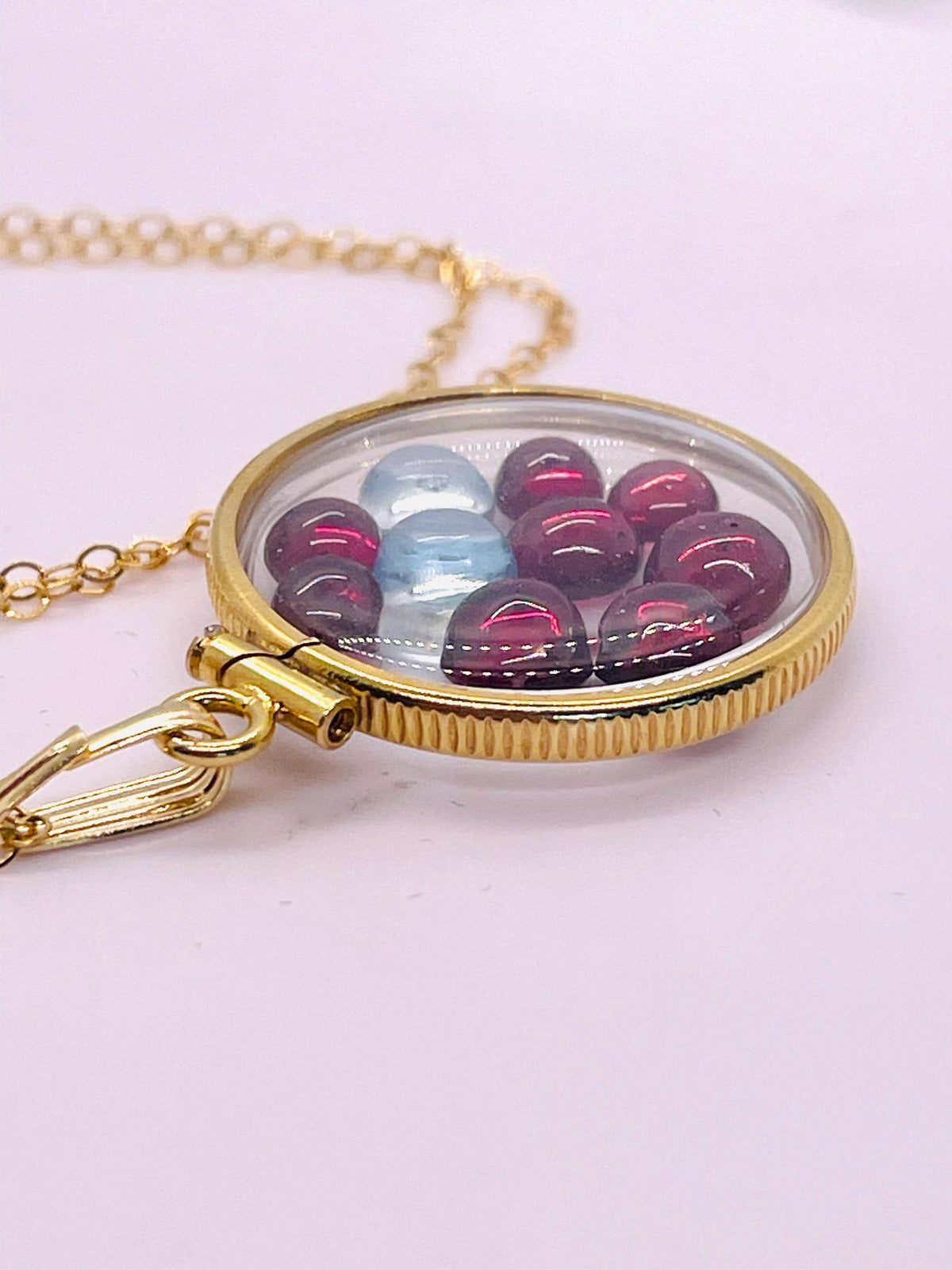 14k solid gold 22 mm handmade shaker locket filled with garnet and white topaz