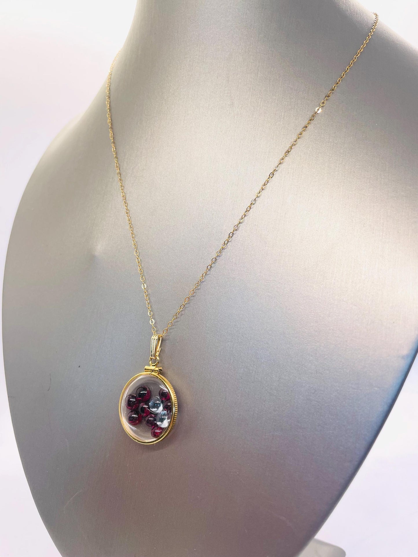 14k solid gold 22 mm handmade shaker locket filled with garnet and white topaz
