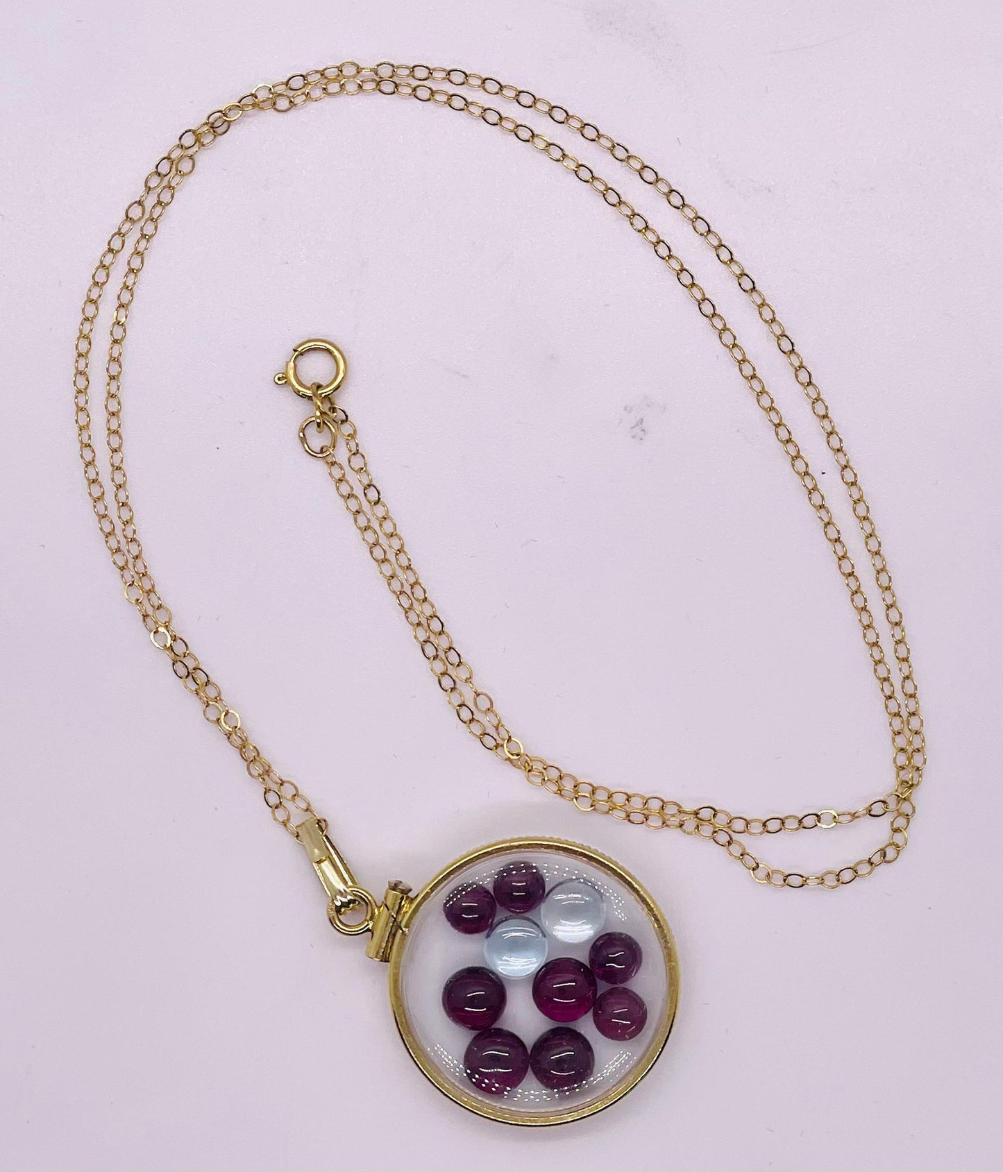 14k solid gold 22 mm handmade shaker locket filled with garnet and white topaz