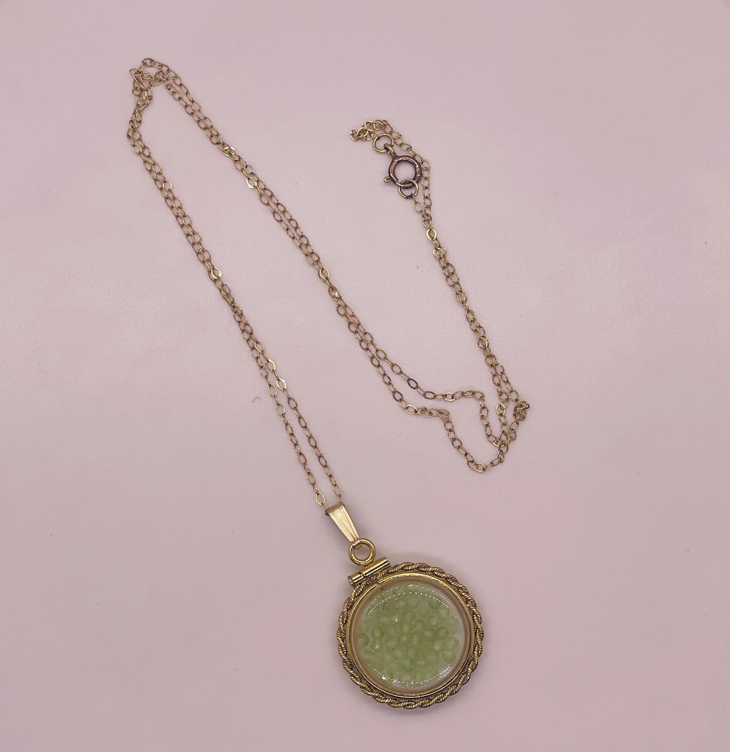 Hand made 21 mm nickel size 14k gold filled lucite genuine peridot shaker locket with rope edge and  beautiful bead crystals.