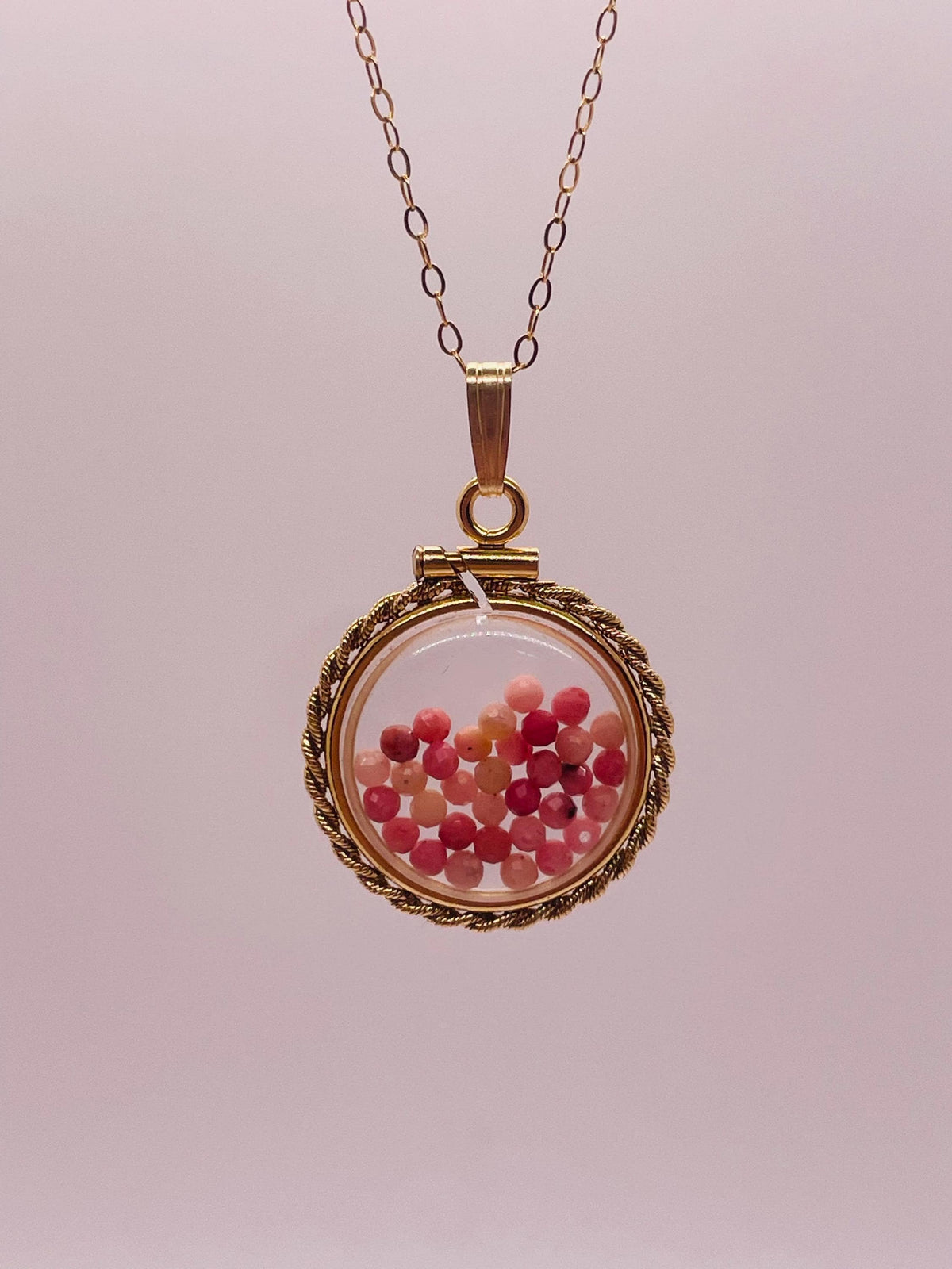 Hand made 21 mm nickel size 14k gold filled lucite genuine rhodonite shaker locket with rope edge and  beautiful bead crystals.