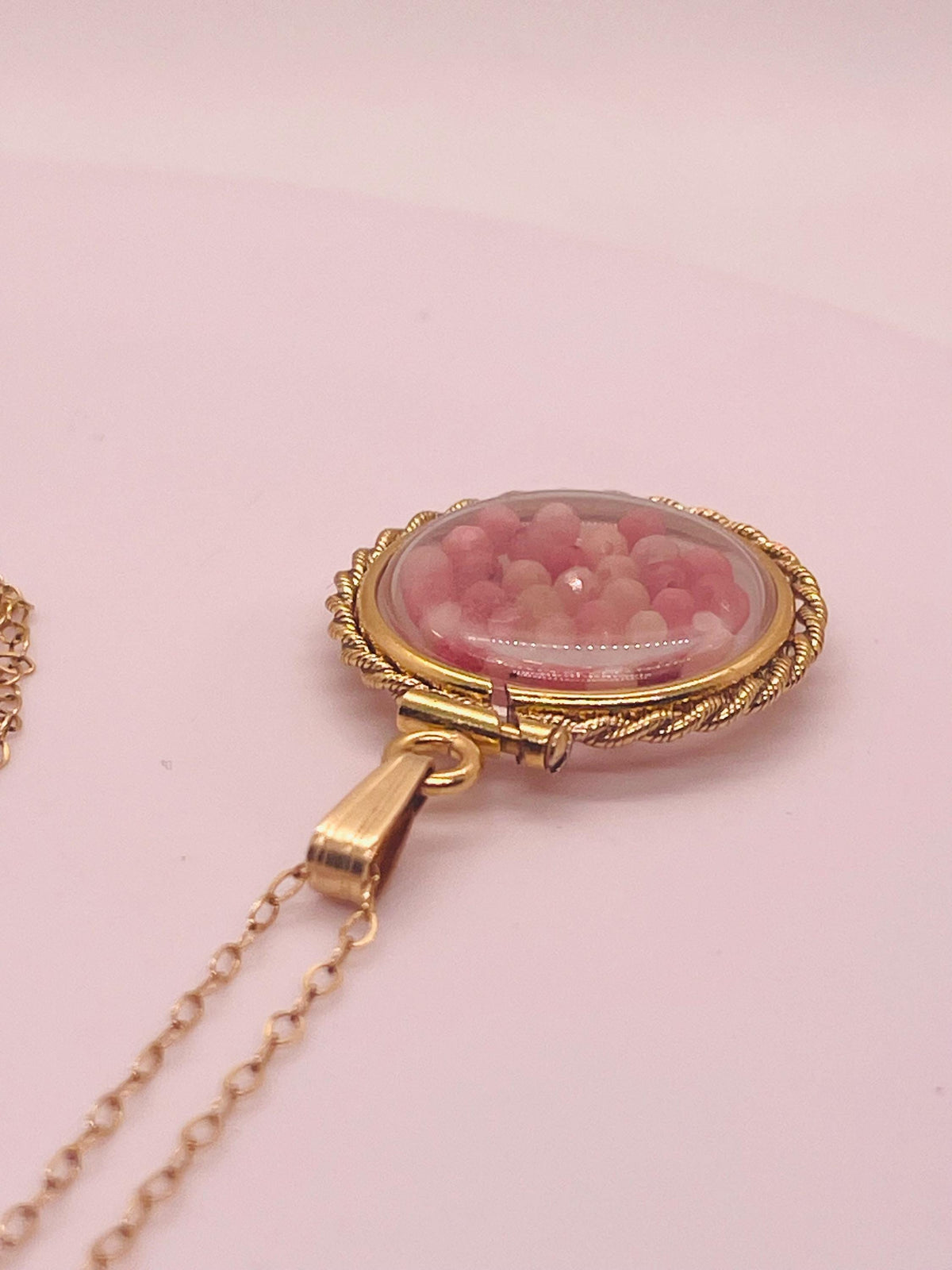 Hand made 21 mm nickel size 14k gold filled lucite genuine rhodonite shaker locket with rope edge and  beautiful bead crystals.