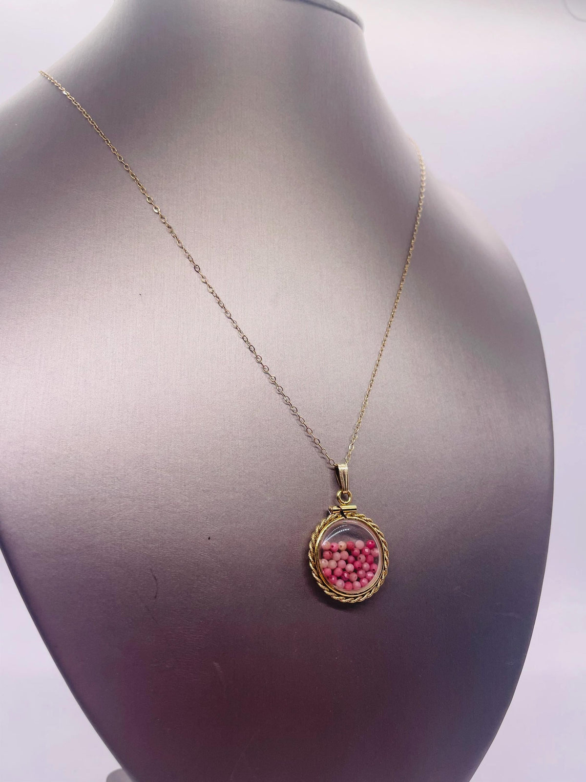 Hand made 21 mm nickel size 14k gold filled lucite genuine rhodonite shaker locket with rope edge and  beautiful bead crystals.