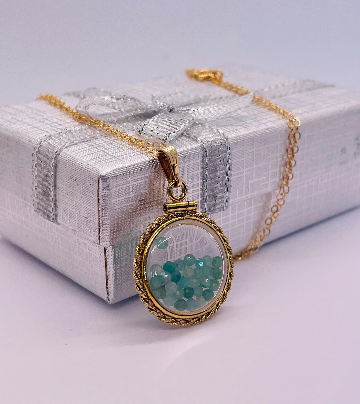 Hand made 21 mm nickel size 14k gold filled lucite genuine emerald shaker locket with rope edge and beautiful bead crystals.