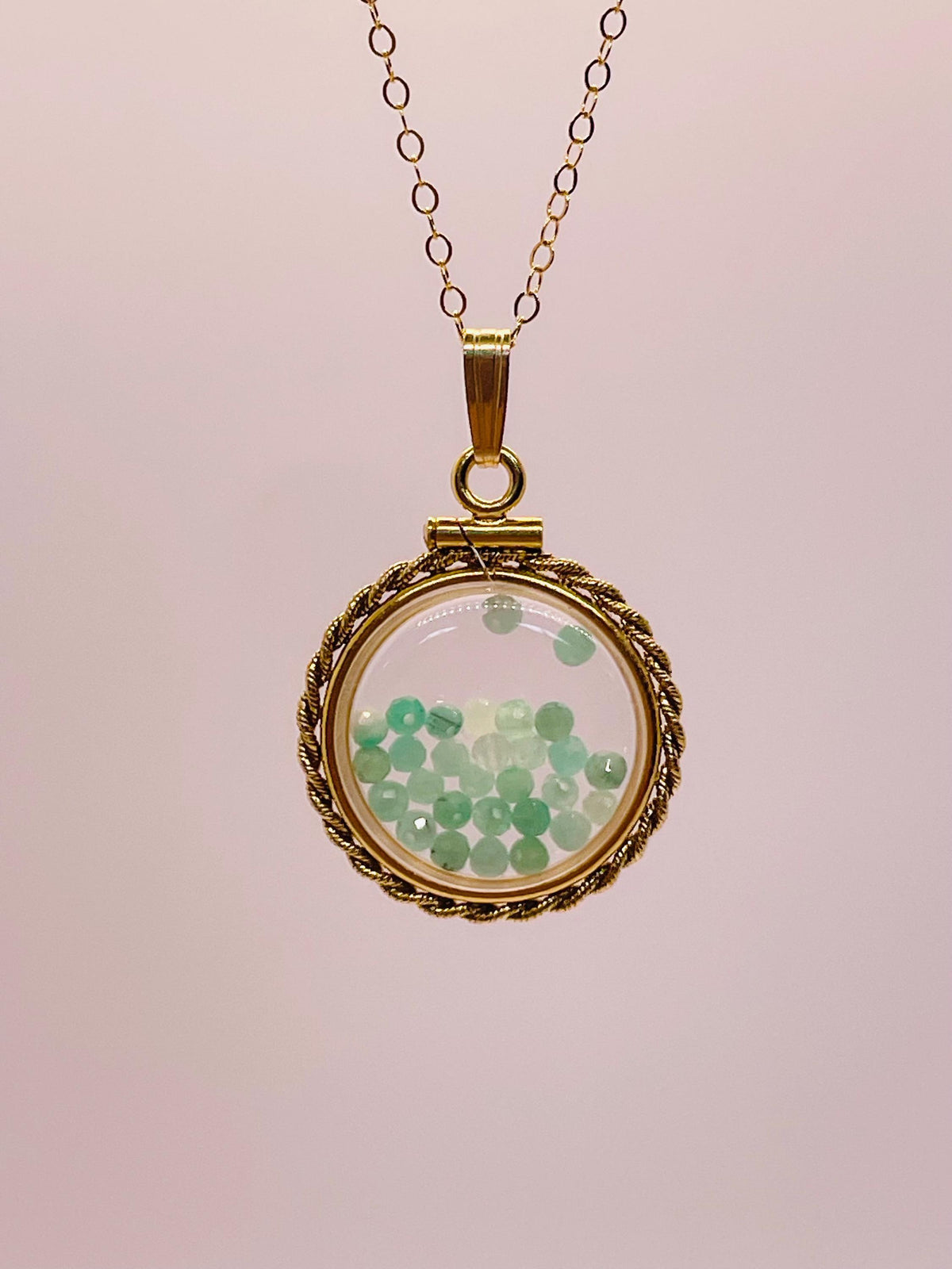 Hand made 21 mm nickel size 14k gold filled lucite genuine emerald shaker locket with rope edge and beautiful bead crystals.