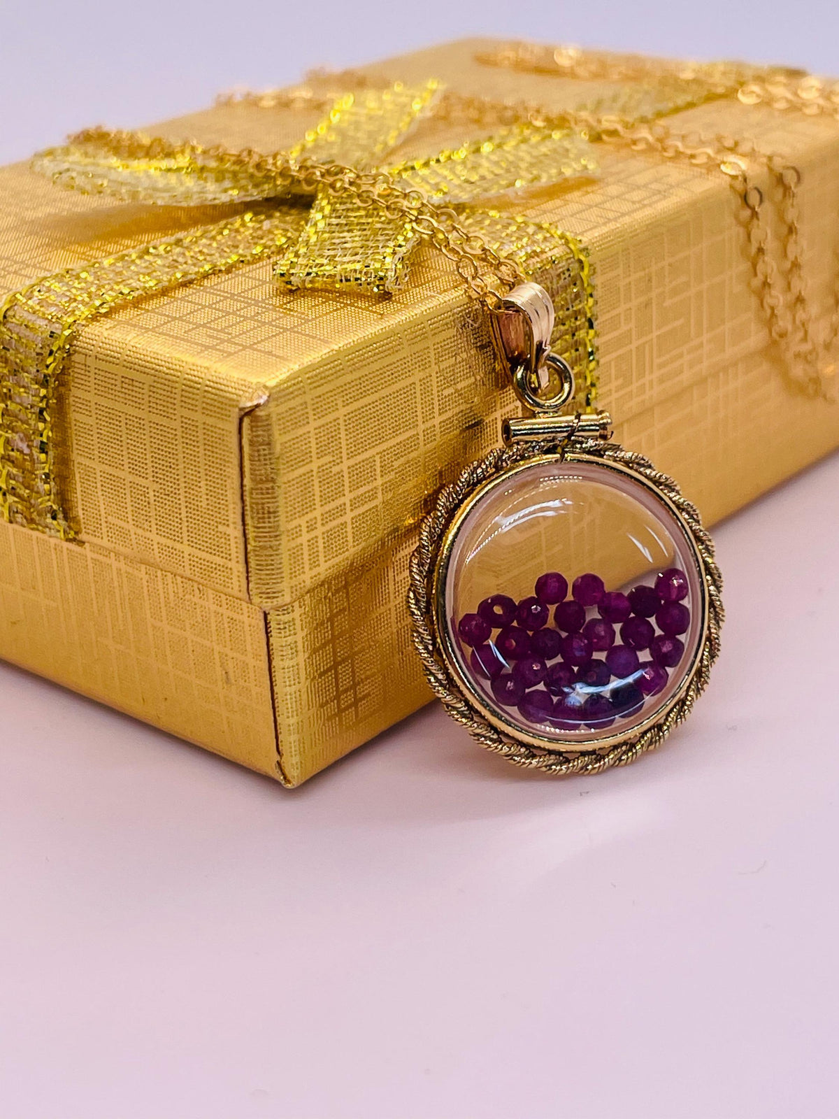 Hand made 21 mm nickel size 14k gold filled lucite genuine ruby shaker locket with rope edge and beautiful bead crystals.