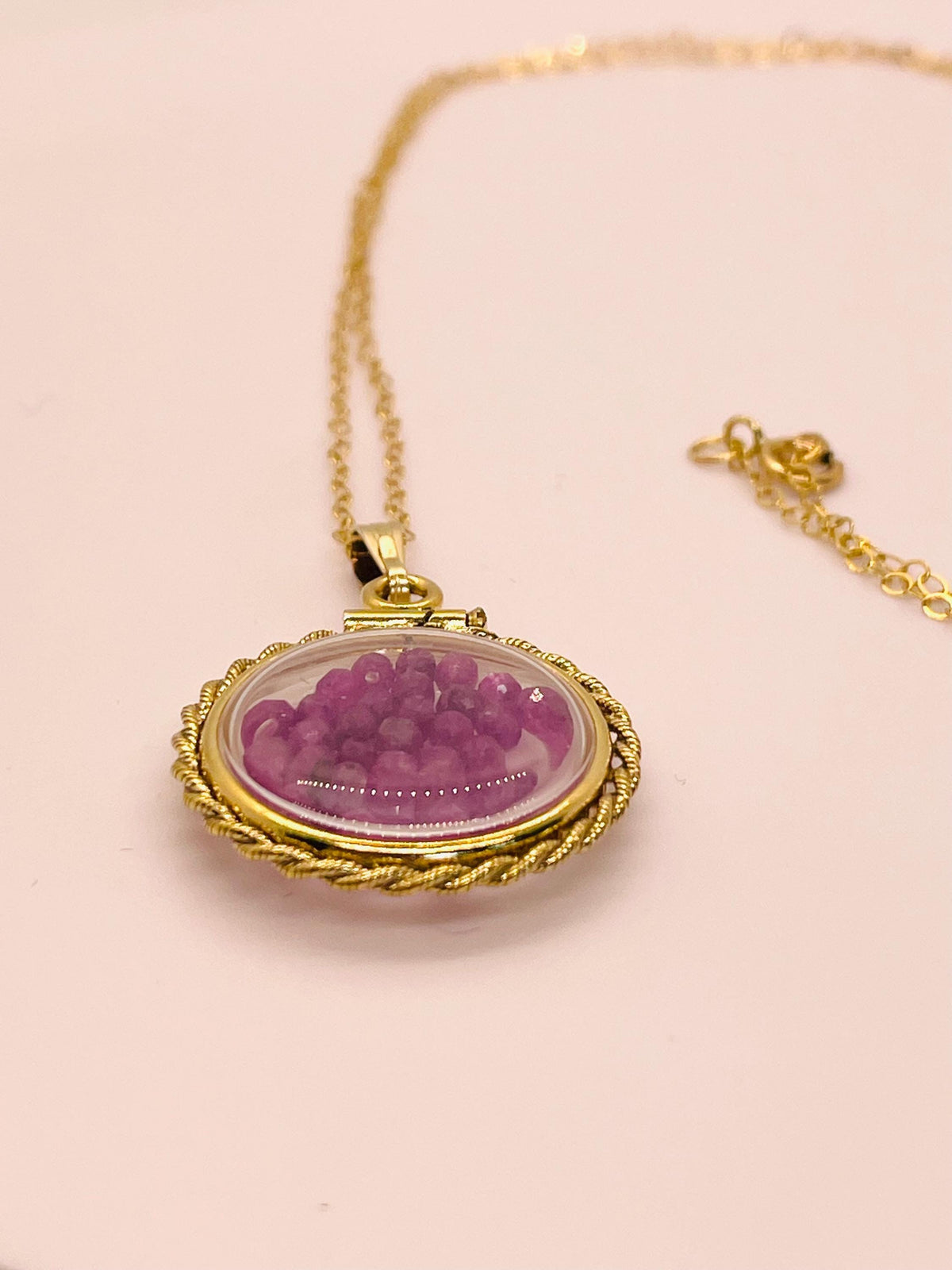 Hand made 21 mm nickel size 14k gold filled lucite genuine ruby shaker locket with rope edge and beautiful bead crystals.