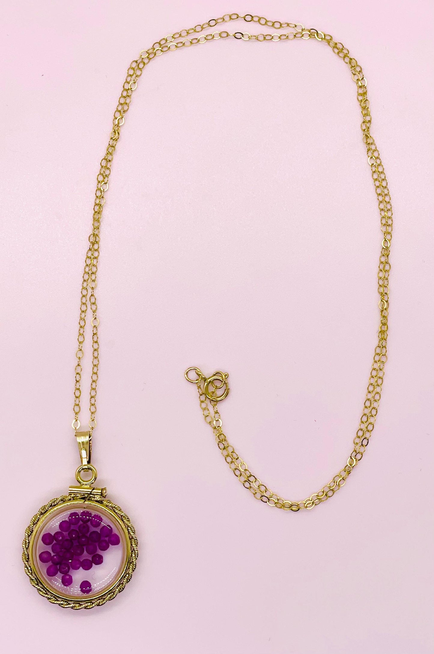 Hand made 21 mm nickel size 14k gold filled lucite genuine ruby shaker locket with rope edge and beautiful bead crystals.