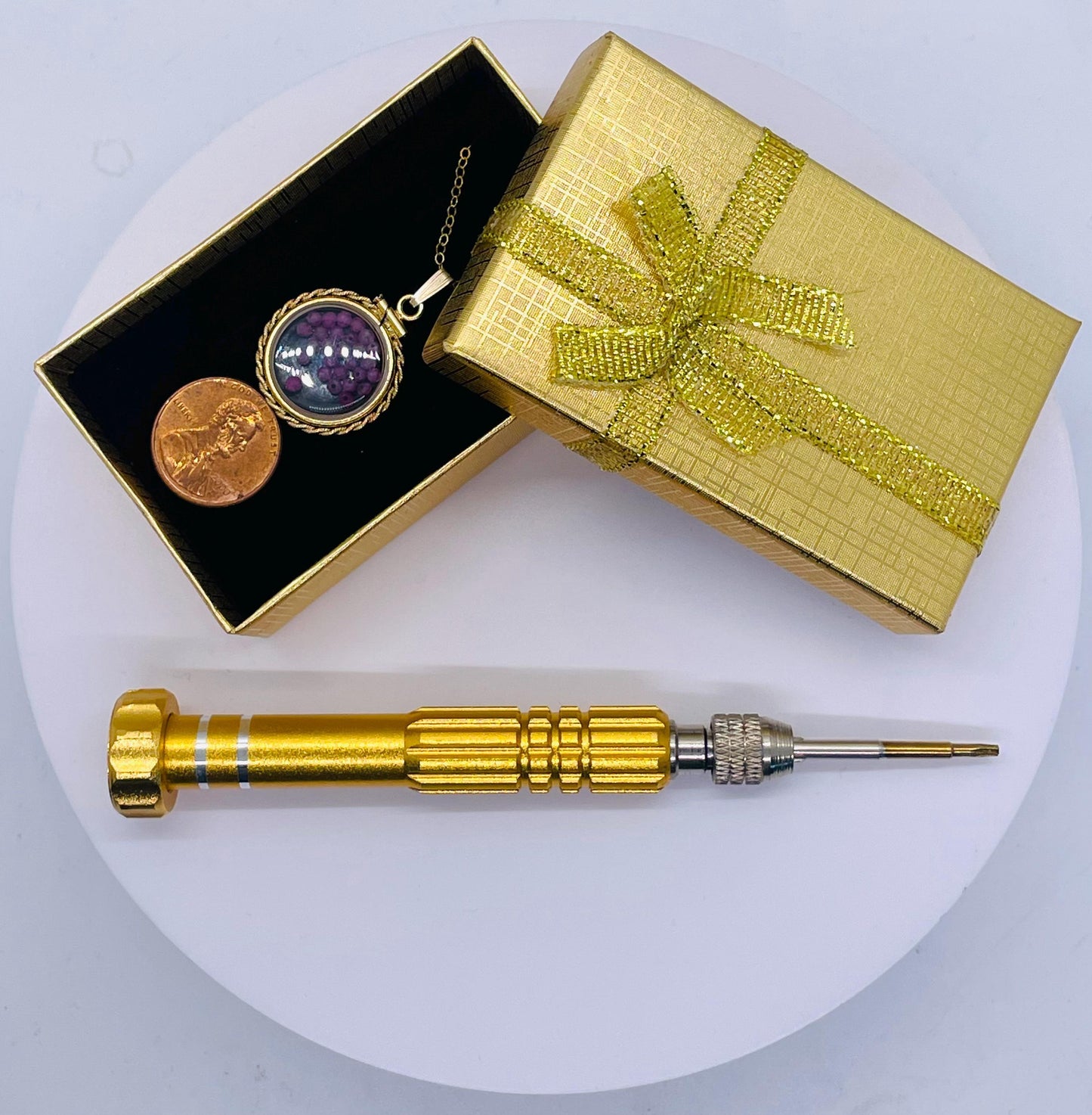 Hand made 21 mm nickel size 14k gold filled lucite genuine ruby shaker locket with rope edge and beautiful bead crystals.