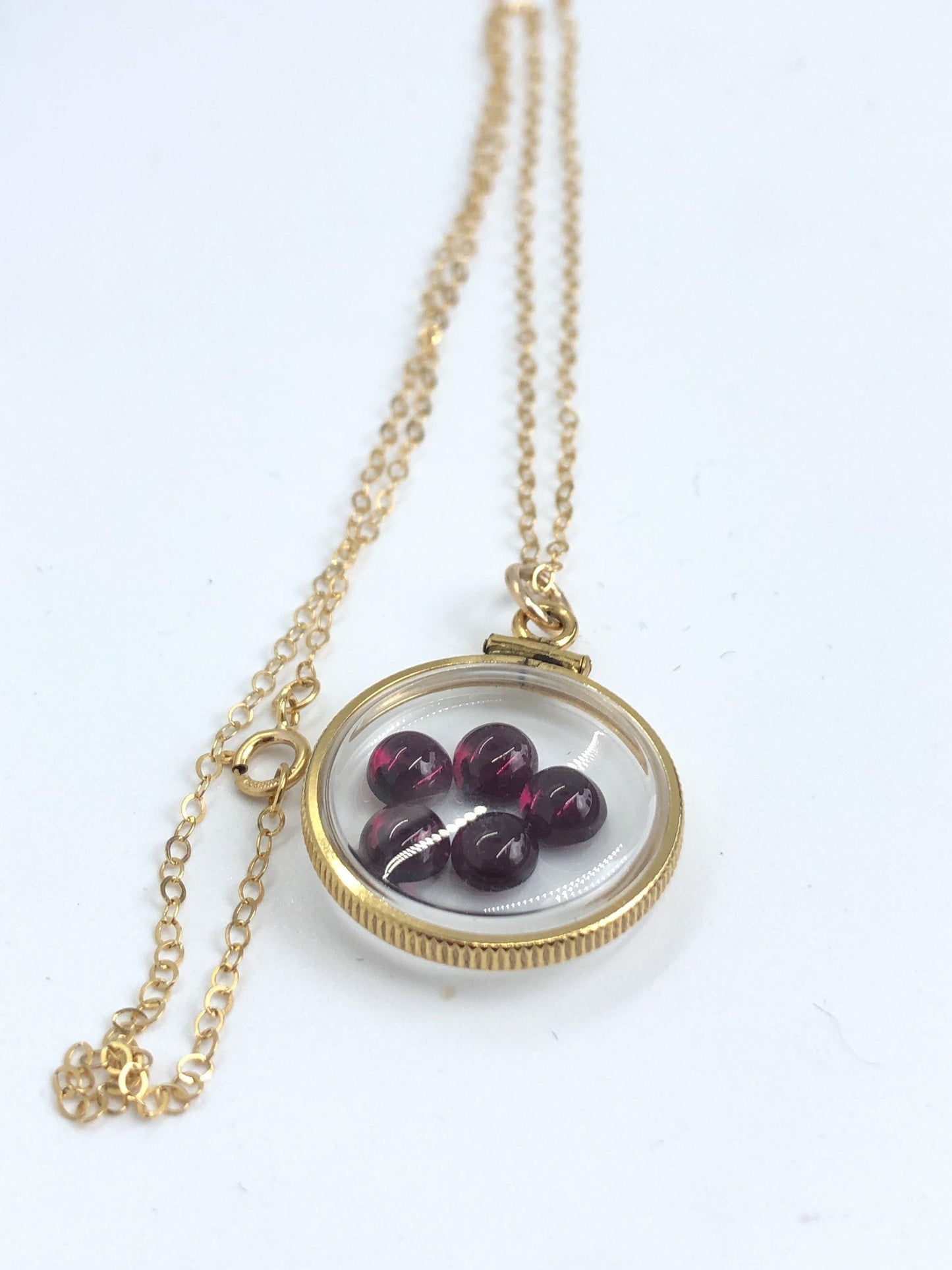 Vintage garnet shaker locket, 12k gold filled  w/ 4 ctw  of beautiful gems, january birthstone new old stock 50 years old  limited supply