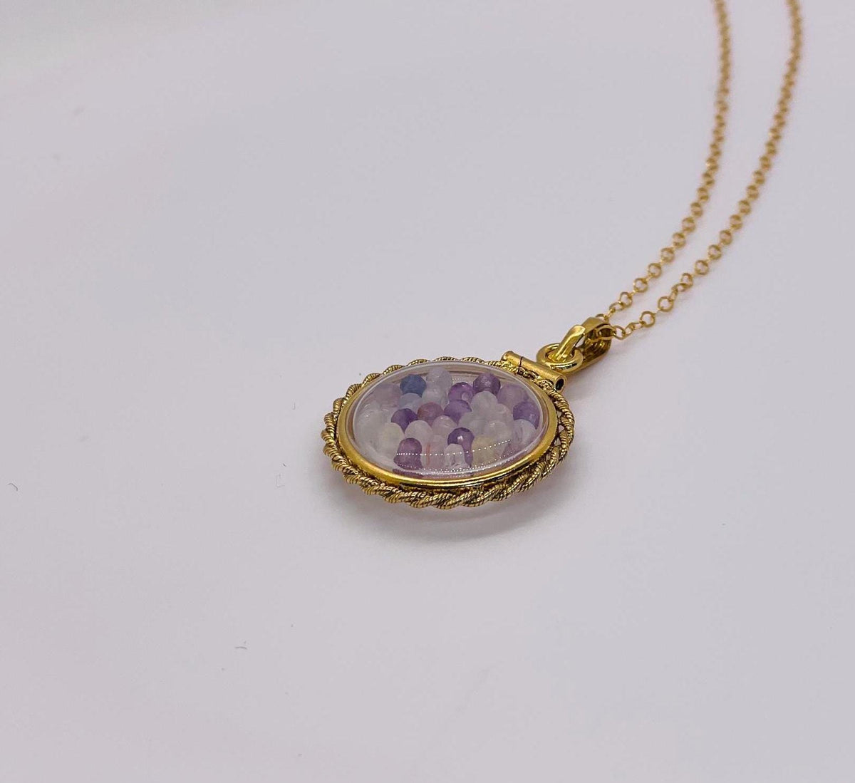 Hand made 21 mm nickel size 14k gold filled lucite genuine fluorite shaker locket with rope edge, with beautiful bead crystals.
