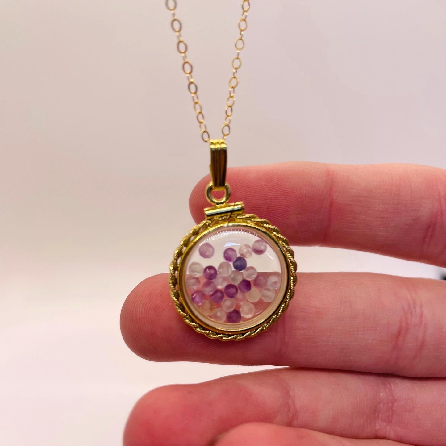 Hand made 21 mm nickel size 14k gold filled lucite genuine fluorite shaker locket with rope edge, with beautiful bead crystals.