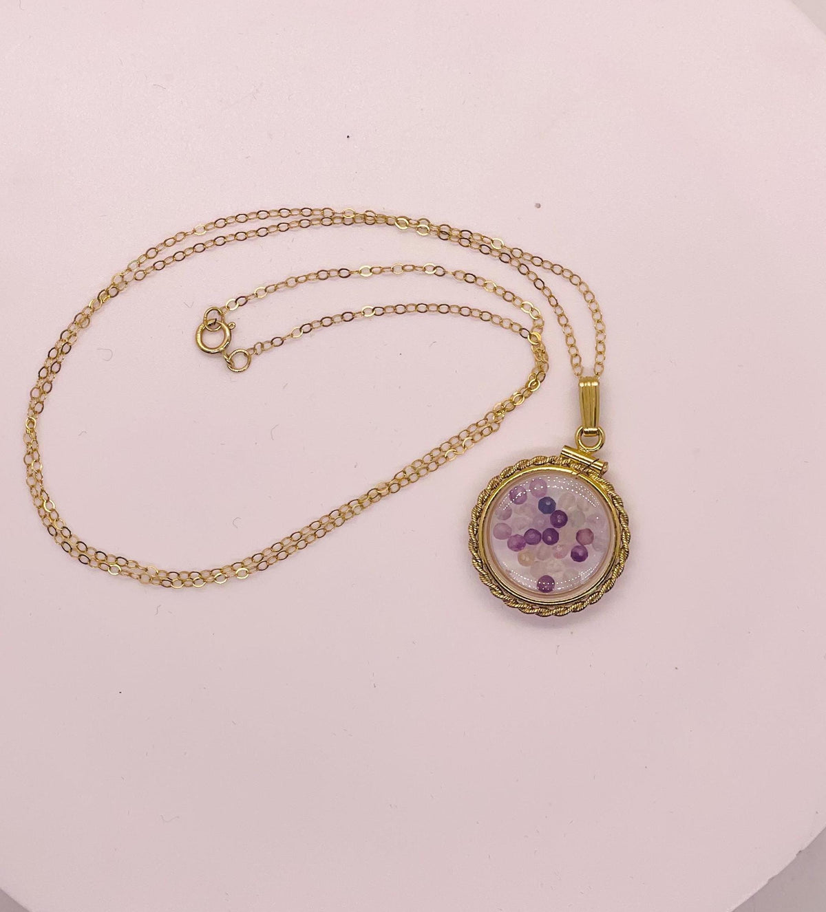 Hand made 21 mm nickel size 14k gold filled lucite genuine fluorite shaker locket with rope edge, with beautiful bead crystals.