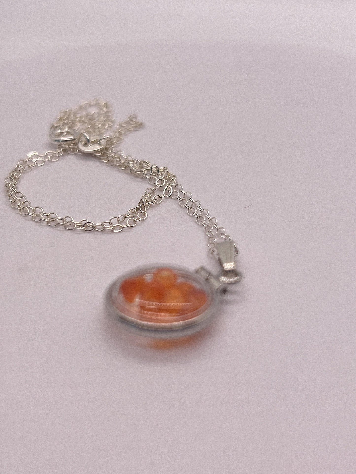 Handmade diminutive sterling silver carnelian shaker locket lucite view locket, necklace, beautiful natural orange cabochons. 1.25 tcw