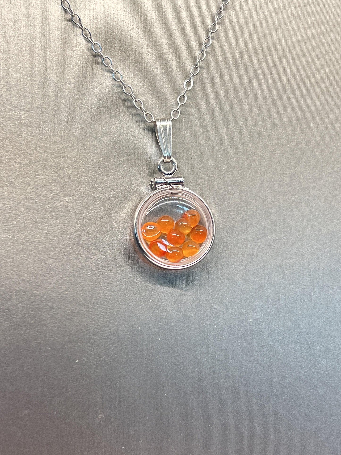 Handmade diminutive sterling silver carnelian shaker locket lucite view locket, necklace, beautiful natural orange cabochons. 1.25 tcw