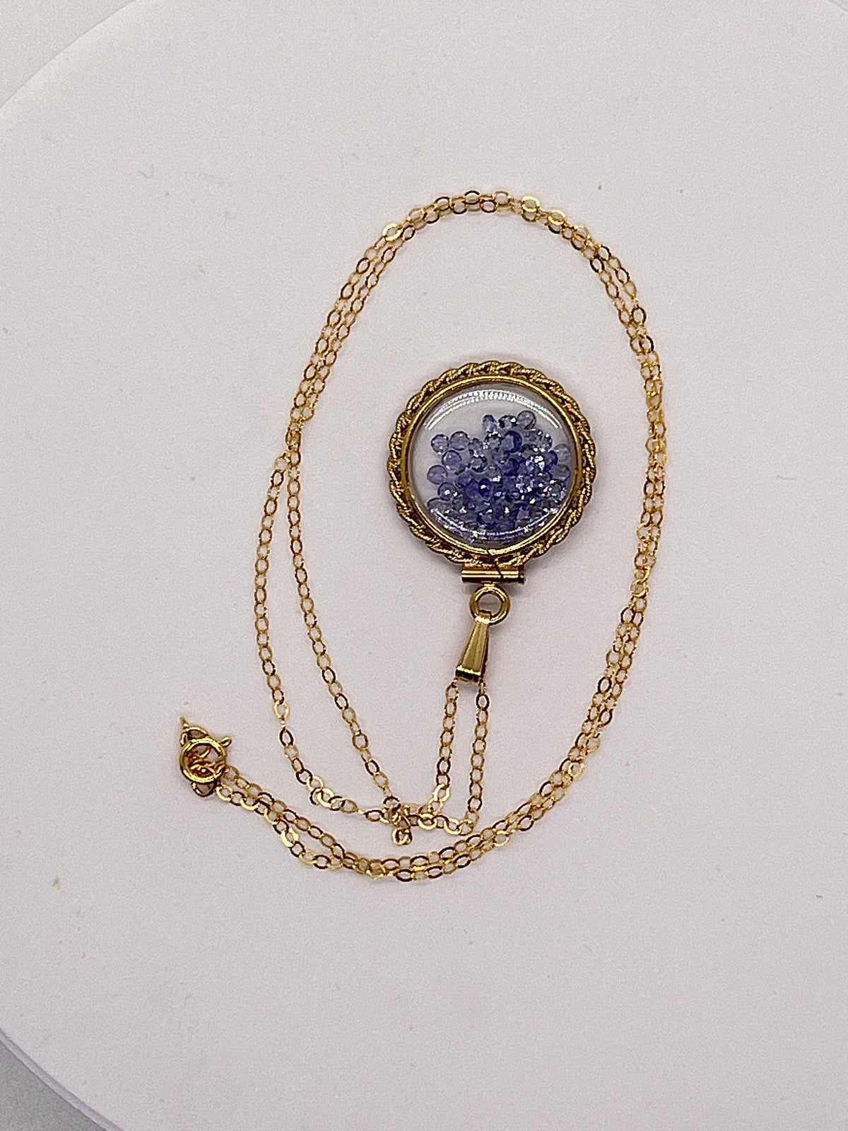 Hand made 21 mm nickel size 14k gold filled lucite tanzanite shaker locket with rope edge december birthstone.