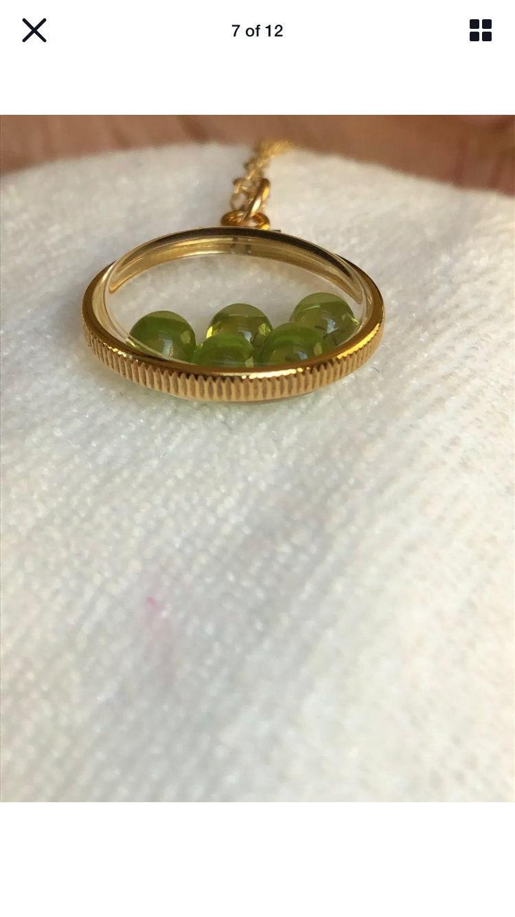 Vintage 12k gold filled locket with five 5mm beautiful green peridot cabochons, 3.26 tcw