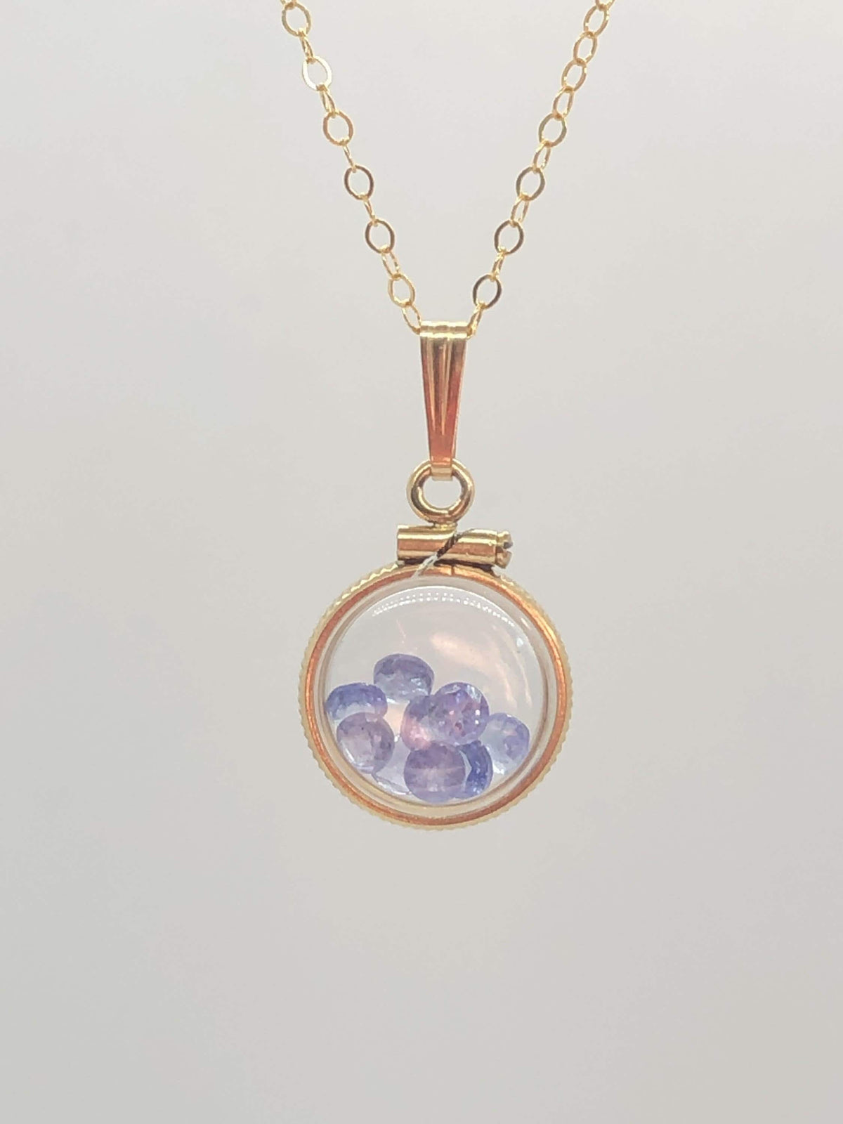 Diminutive  tanzanite shaker locket 14k gf or silver  with beautiful december birthstone, .9tcw round cut gems