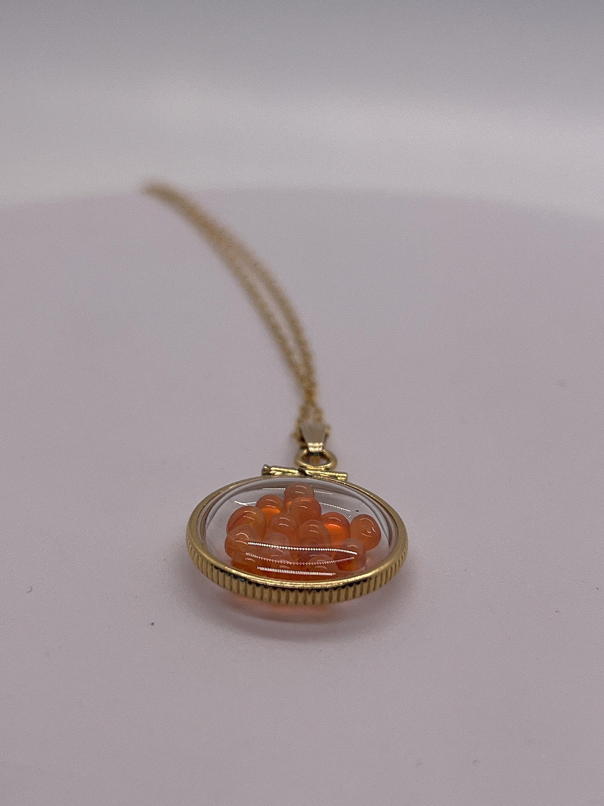 Handmade dime sized carnelian shaker locket,gold filled locket, 2.10 tcw round carnelian cabochons.