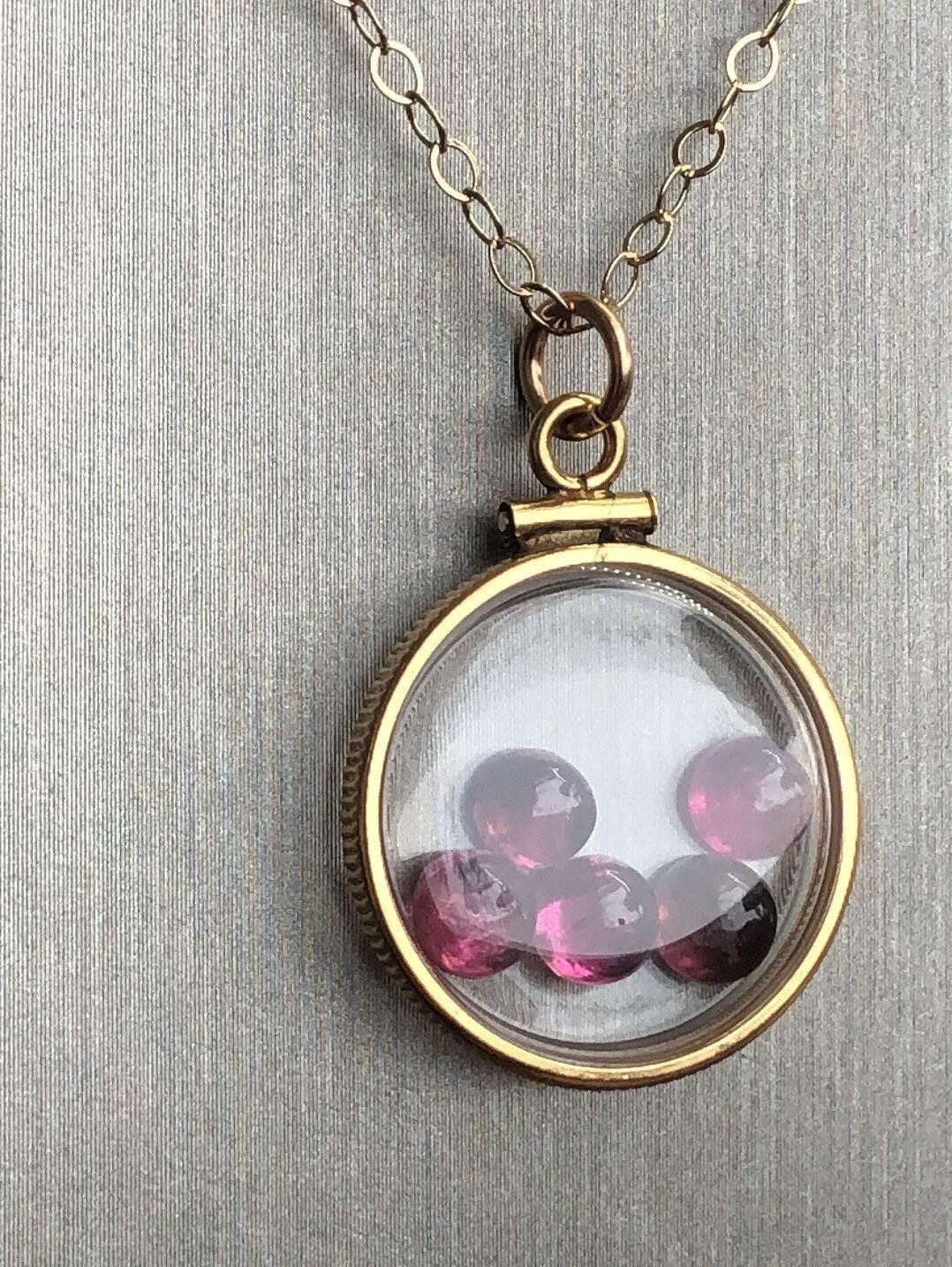 Vintage tourmaline shaker locket  12k gold filled with natural gems. new old stock 50 years old limited supply while last