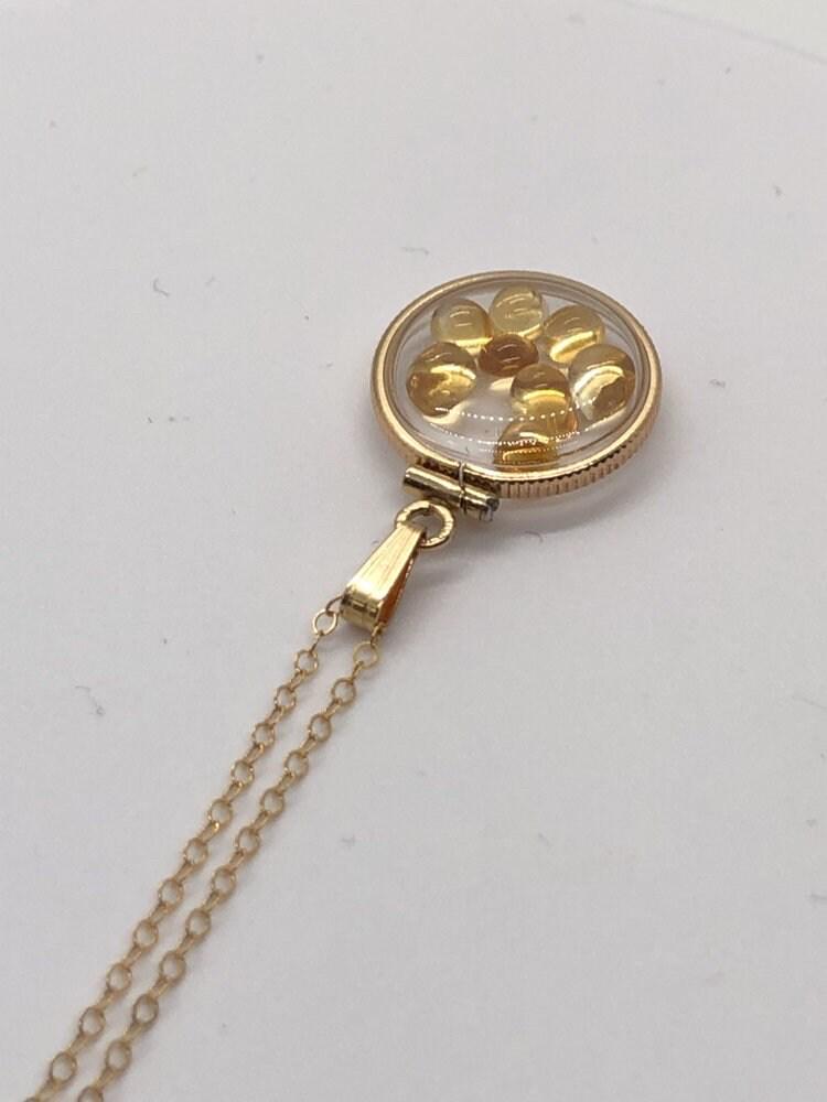 Handmade dime size citrine shaker locket 14k gold filled with beautiful november birthstone. you can custom create a locket, just ask!