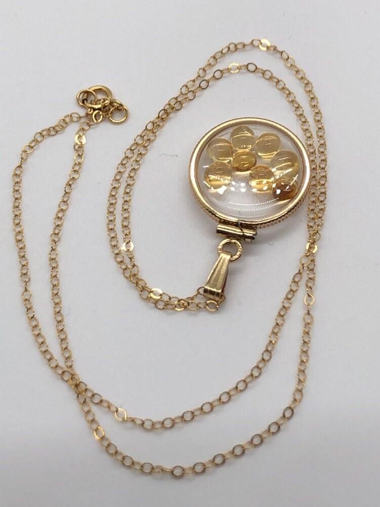 Handmade dime size citrine shaker locket 14k gold filled with beautiful november birthstone. you can custom create a locket, just ask!