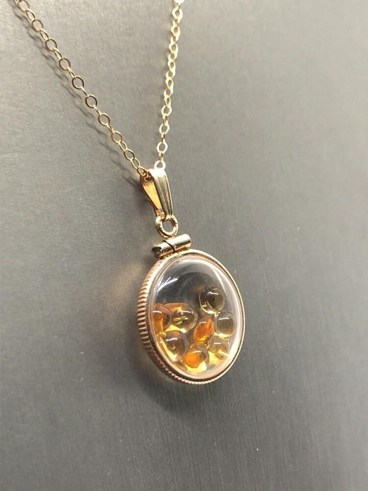 Handmade dime size citrine shaker locket 14k gold filled with beautiful november birthstone. you can custom create a locket, just ask!