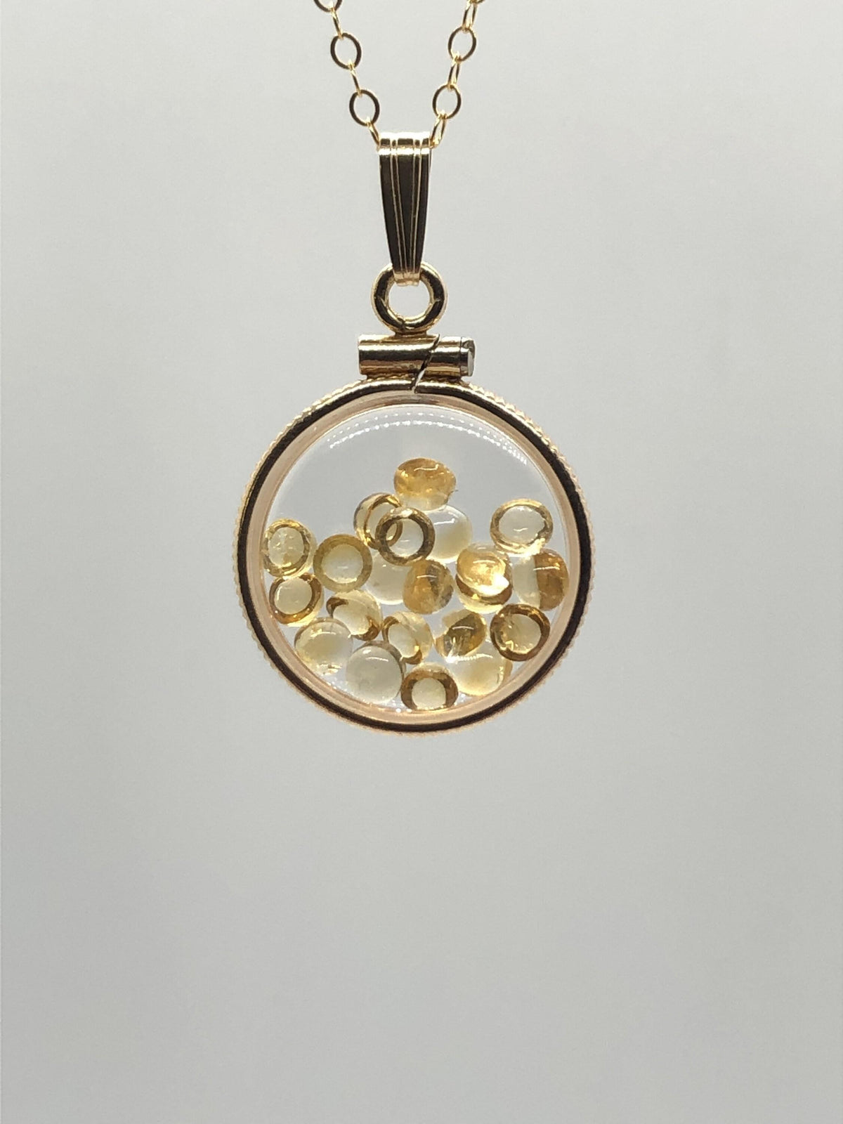 Handmade dime size citrine shaker locket 14k gold filled with beautiful november birthstone. you can custom create a locket, just ask!