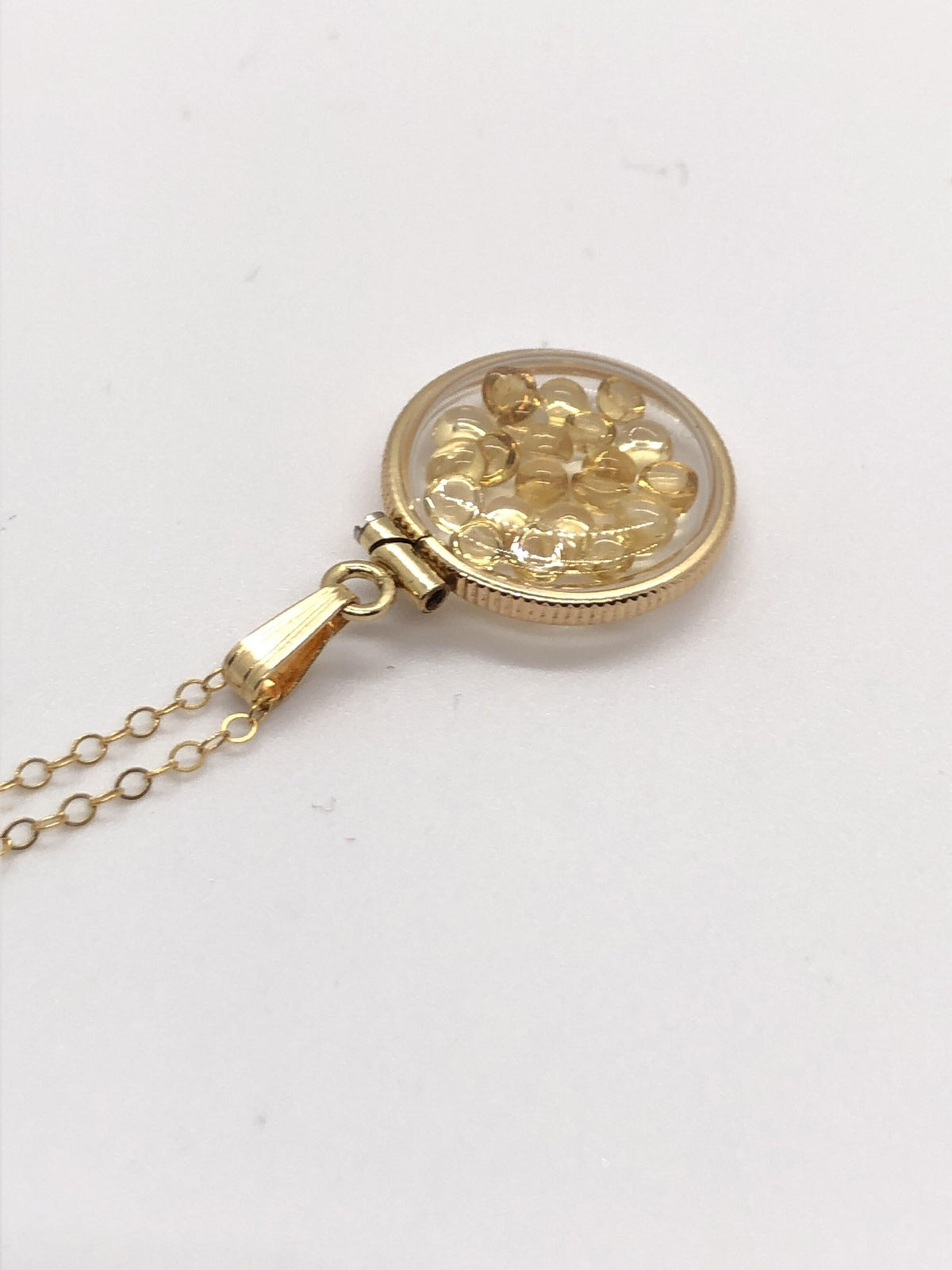 Handmade dime size citrine shaker locket 14k gold filled with beautiful november birthstone. you can custom create a locket, just ask!