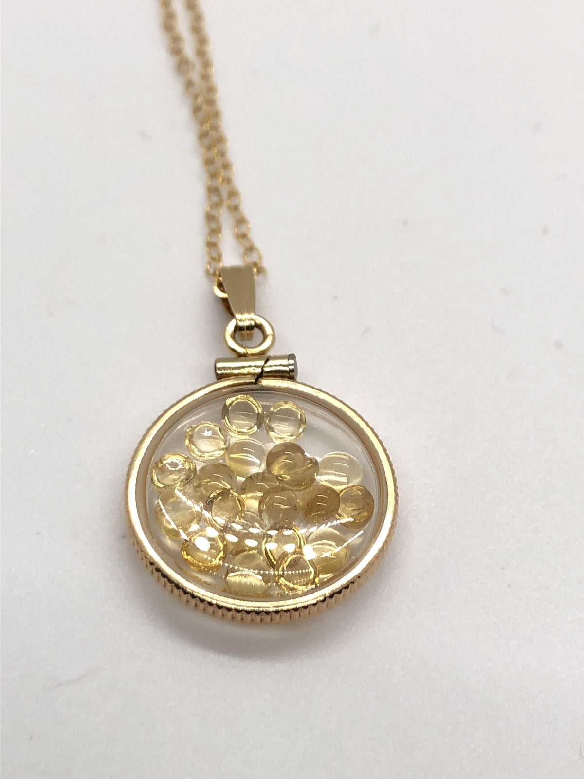 Handmade dime size citrine shaker locket 14k gold filled with beautiful november birthstone. you can custom create a locket, just ask!
