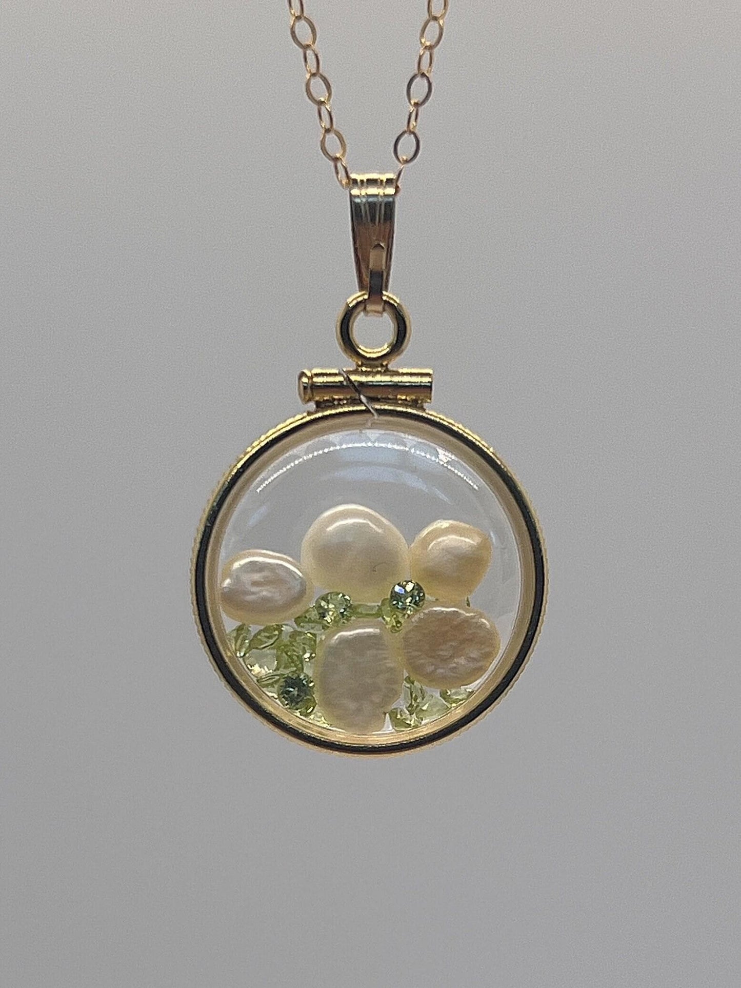 Reversible lucite diamond edge handmade 14k gold filled pearl and peridot shaker  locket nickel size. audrey design.