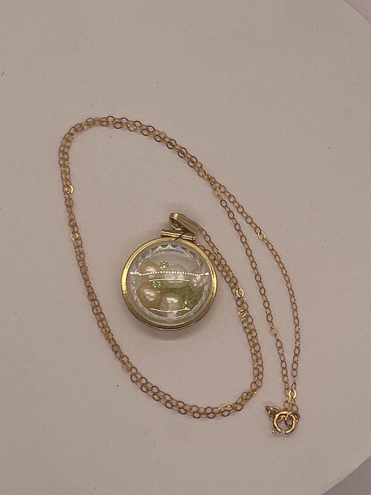 Reversible lucite diamond edge handmade 14k gold filled pearl and peridot shaker  locket nickel size. audrey design.