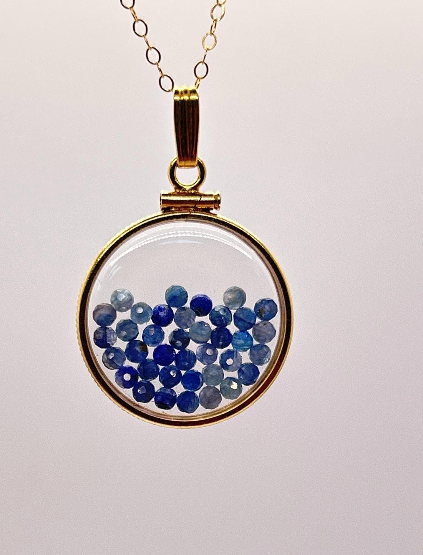 Solid 14k gold lucite 22mm kyanite bead shaker locket with microfaceted 2.5mm beautiful beads. natural gem beads.