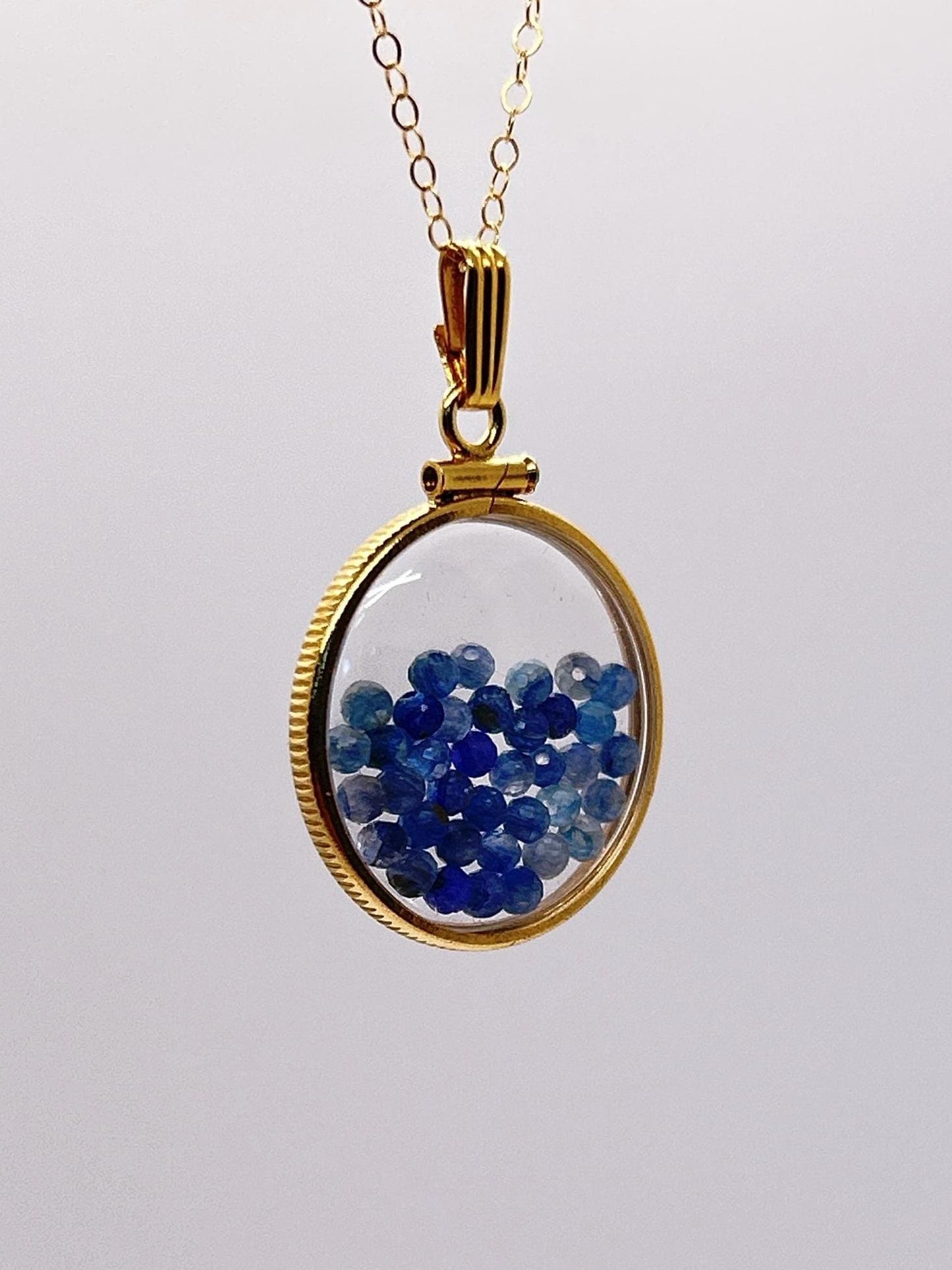 Solid 14k gold lucite 22mm kyanite bead shaker locket with microfaceted 2.5mm beautiful beads. natural gem beads.