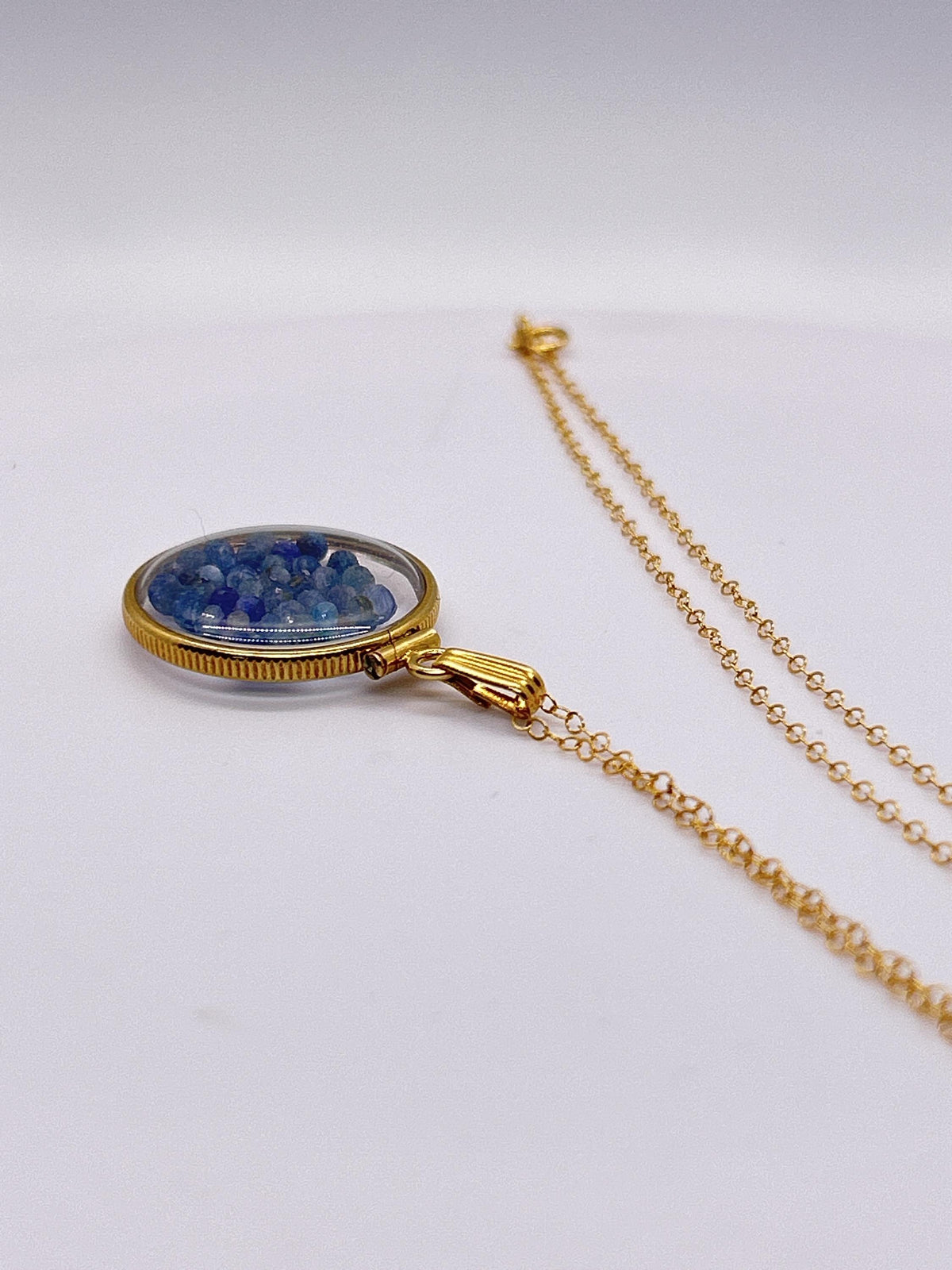 Solid 14k gold lucite 22mm kyanite bead shaker locket with microfaceted 2.5mm beautiful beads. natural gem beads.