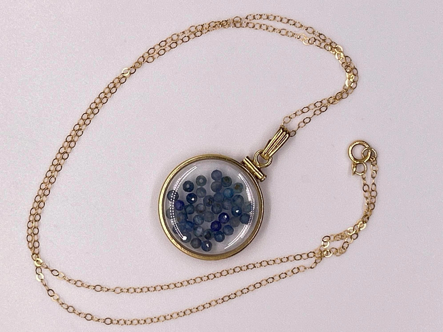 Solid 14k gold lucite 22mm kyanite bead shaker locket with microfaceted 2.5mm beautiful beads. natural gem beads.