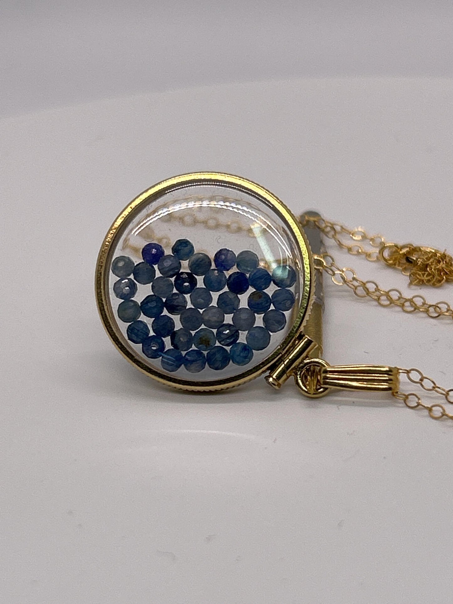 Solid 14k gold lucite 22mm kyanite bead shaker locket with microfaceted 2.5mm beautiful beads. natural gem beads.