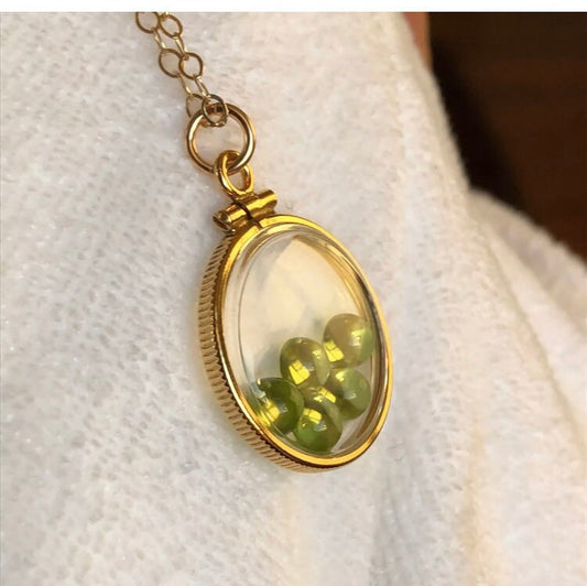 Vintage 12k gold filled locket with five 5mm beautiful green peridot cabochons, 3.26 TCW