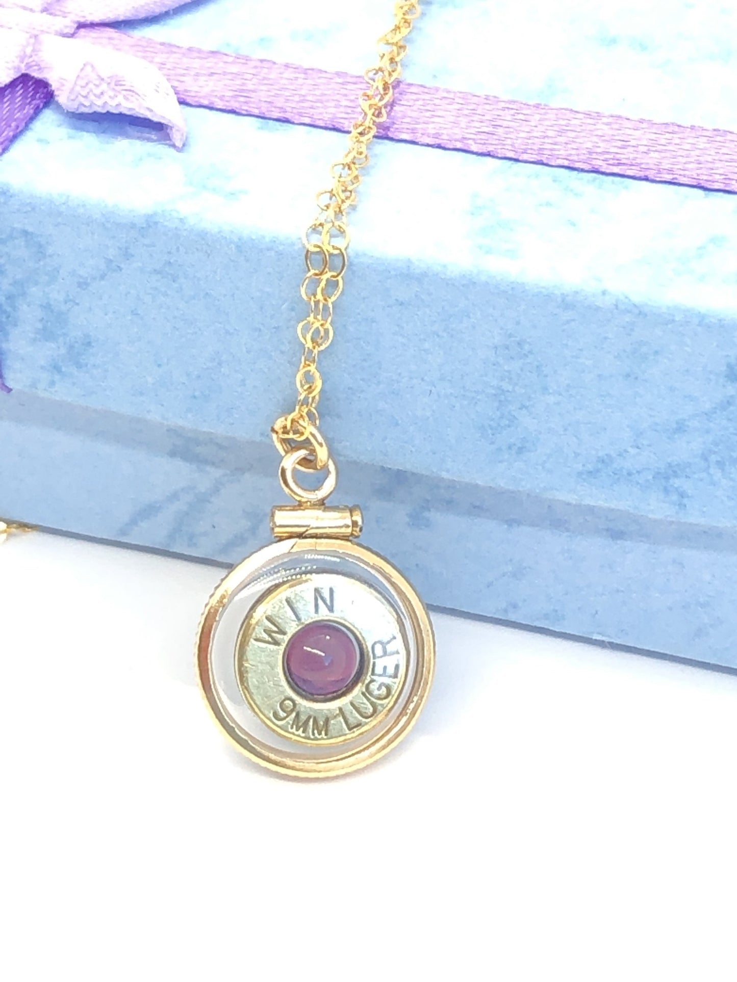 Handmade 14k gold filled 9mm bullet view locket, finished with a 4mm genuine garnet gemstone, view from both sides