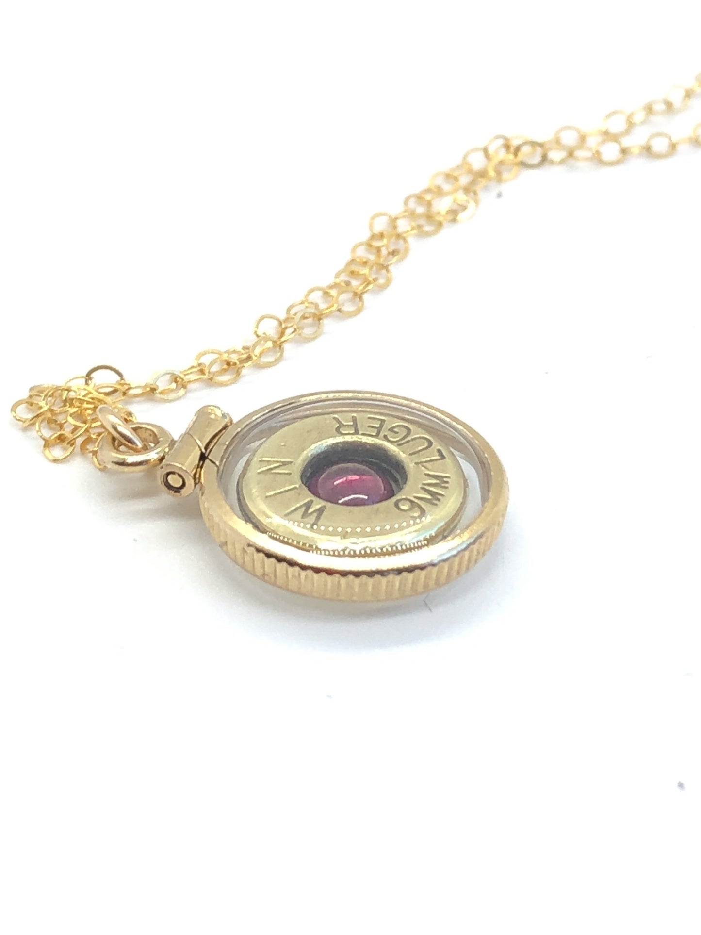 Handmade 14k gold filled 9mm bullet view locket, finished with a 4mm genuine garnet gemstone, view from both sides