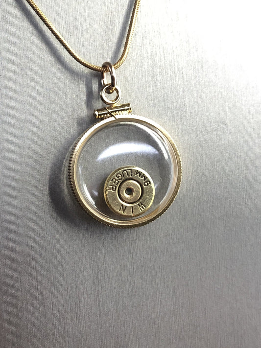 9mm bullet necklace,  back to back view locket, 14k gold filled one side fired primer, other Garnet gem